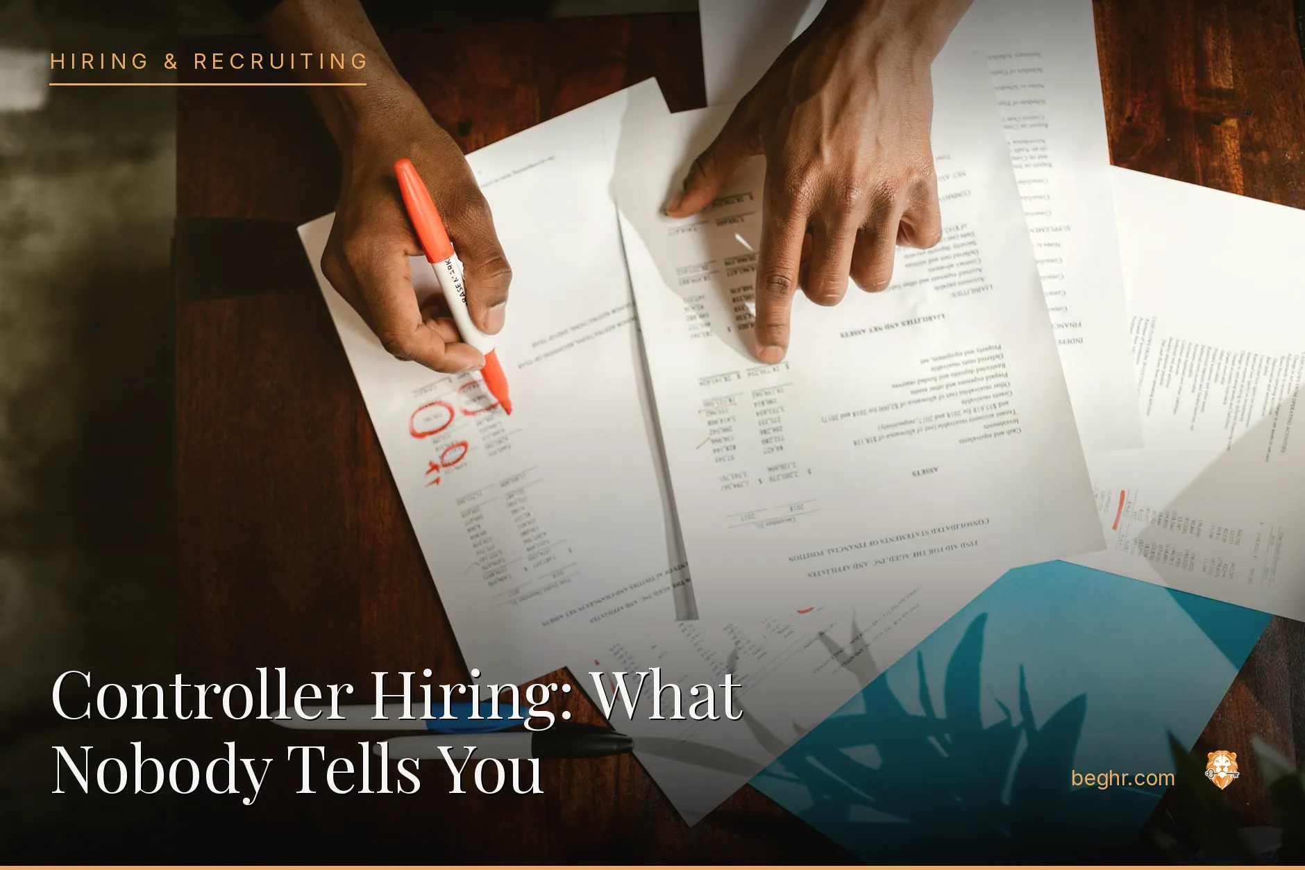An accountant reviewing spreadsheets and documents at a desk