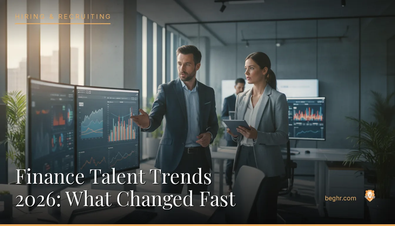 Finance professionals reviewing charts on screens in a modern office