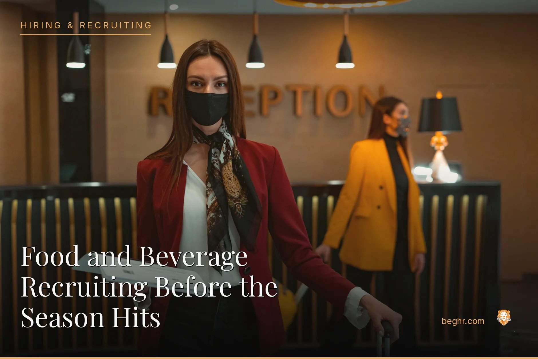 A hotel front desk and staff welcoming guests in a modern lobby