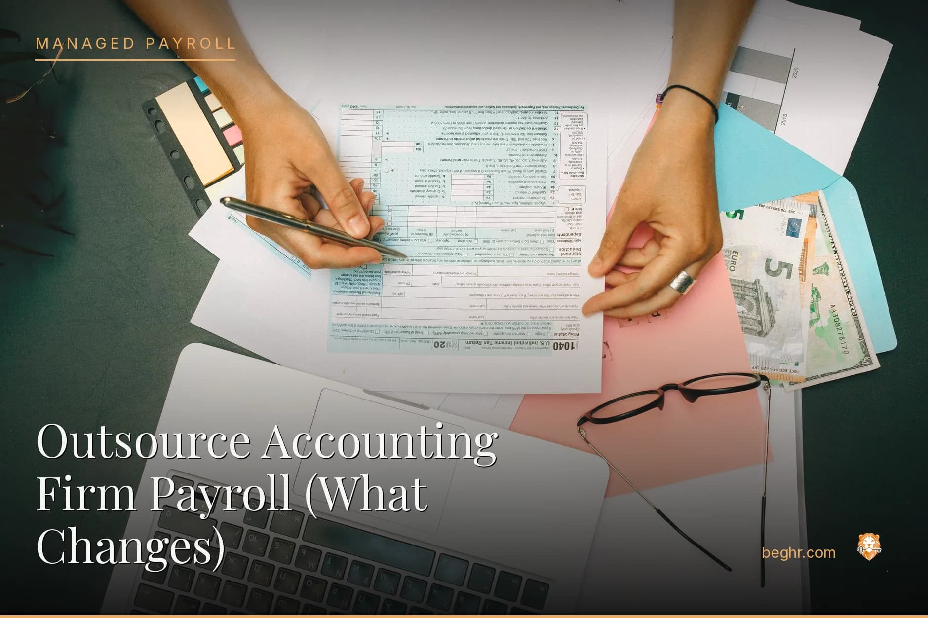 An accountant reviewing spreadsheets and documents at a desk