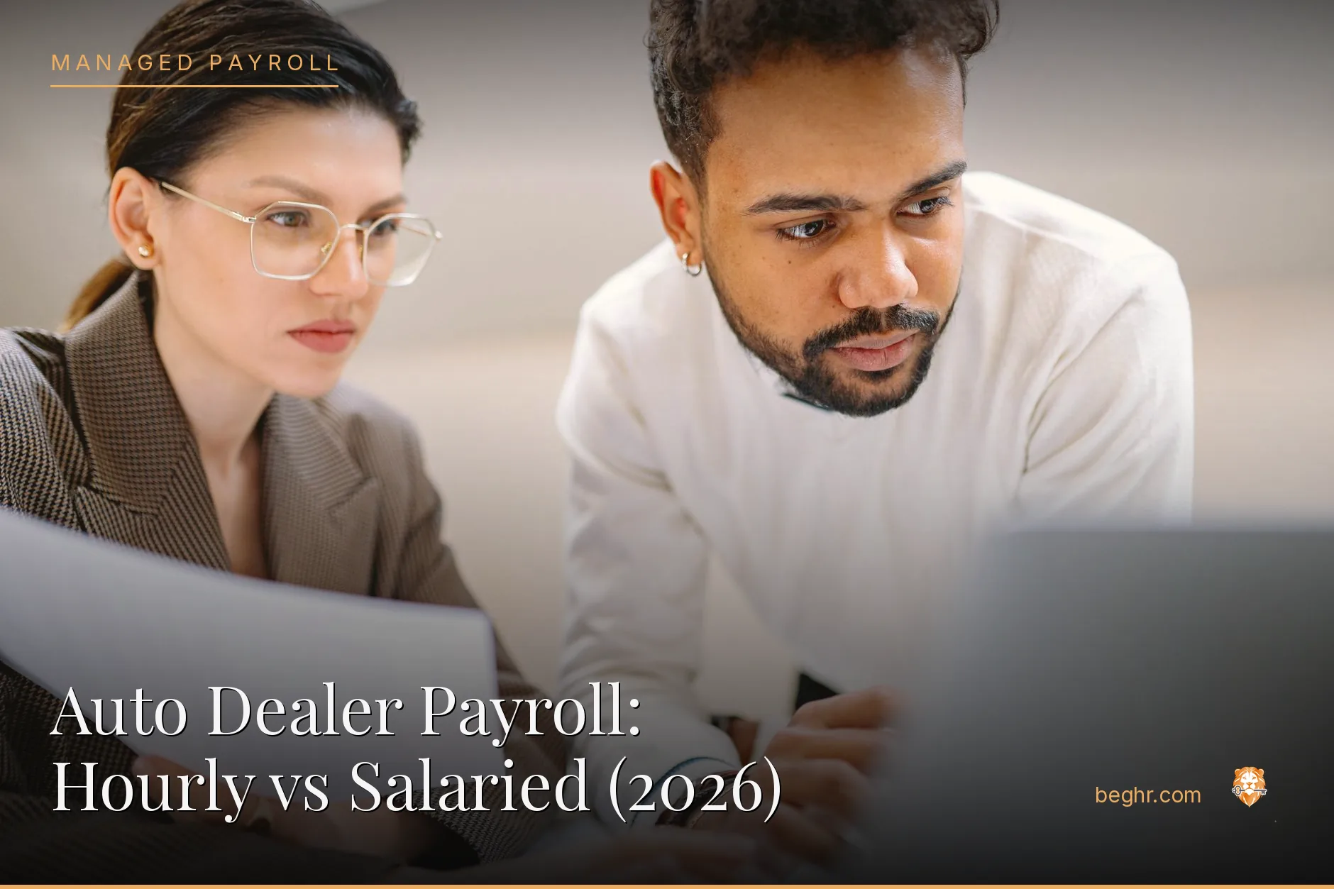 Business professionals reviewing payroll and HR documents in a bright modern office