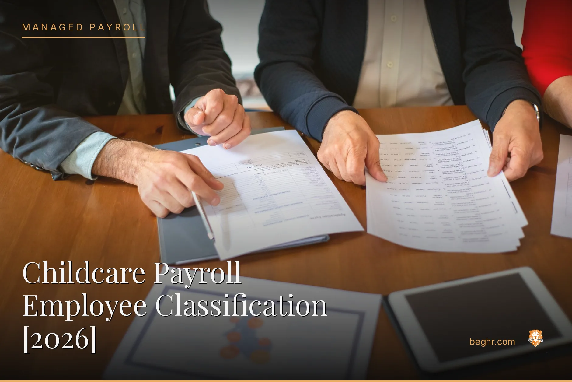 Business professionals reviewing payroll and HR documents in a bright modern office