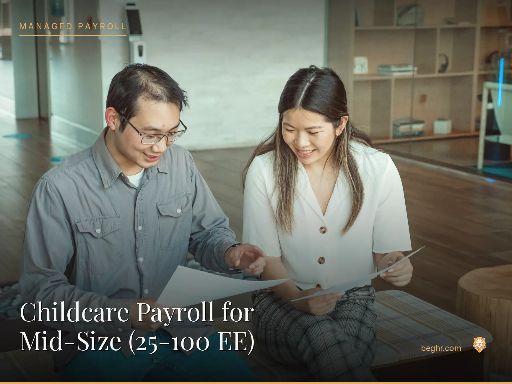 Business professionals reviewing payroll and HR documents in a bright modern office