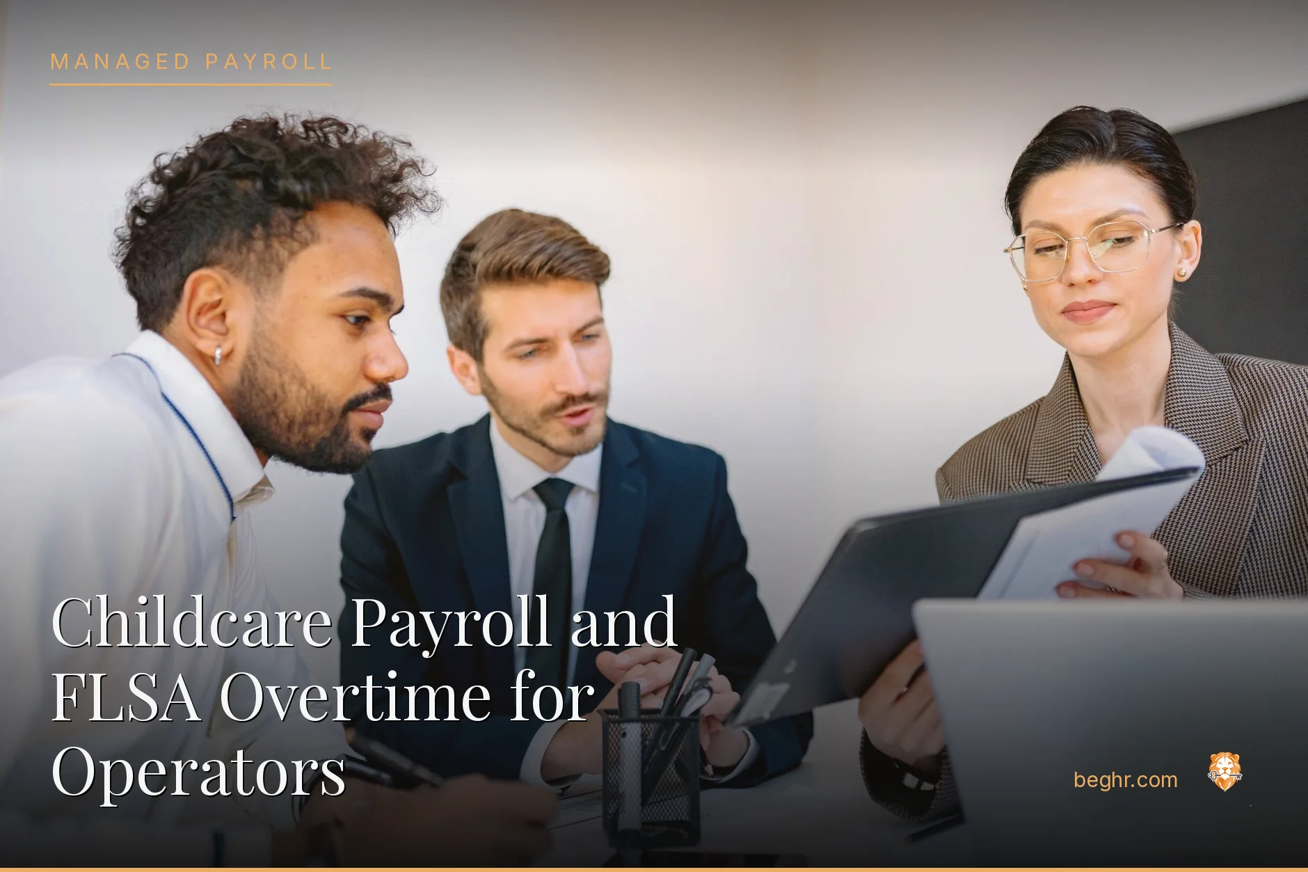 Business professionals reviewing payroll and HR documents in a bright modern office