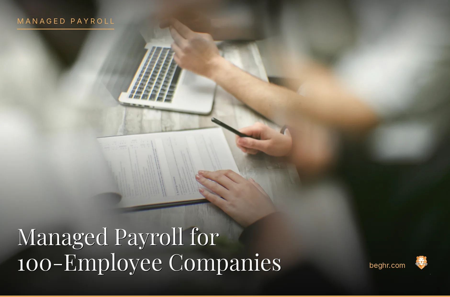 Business professionals reviewing payroll and HR documents in a bright modern office