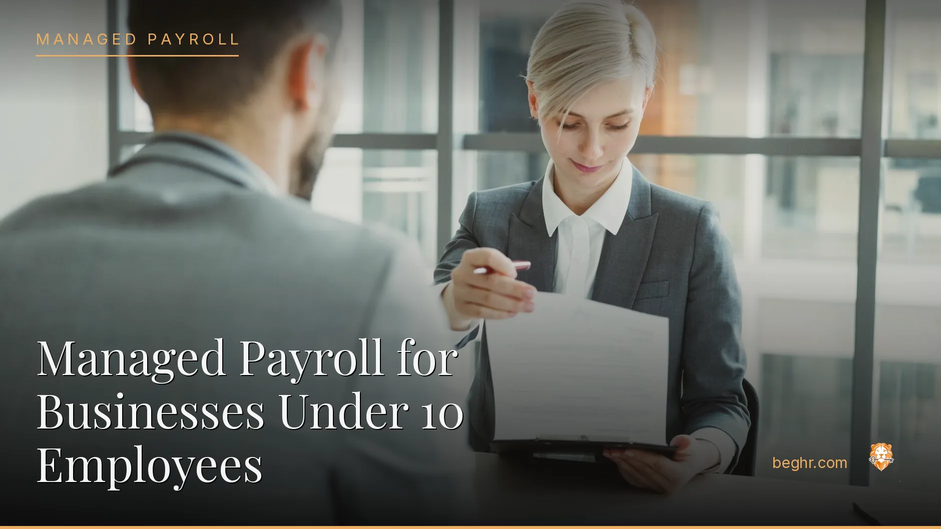Business professionals reviewing payroll and HR documents in a bright modern office