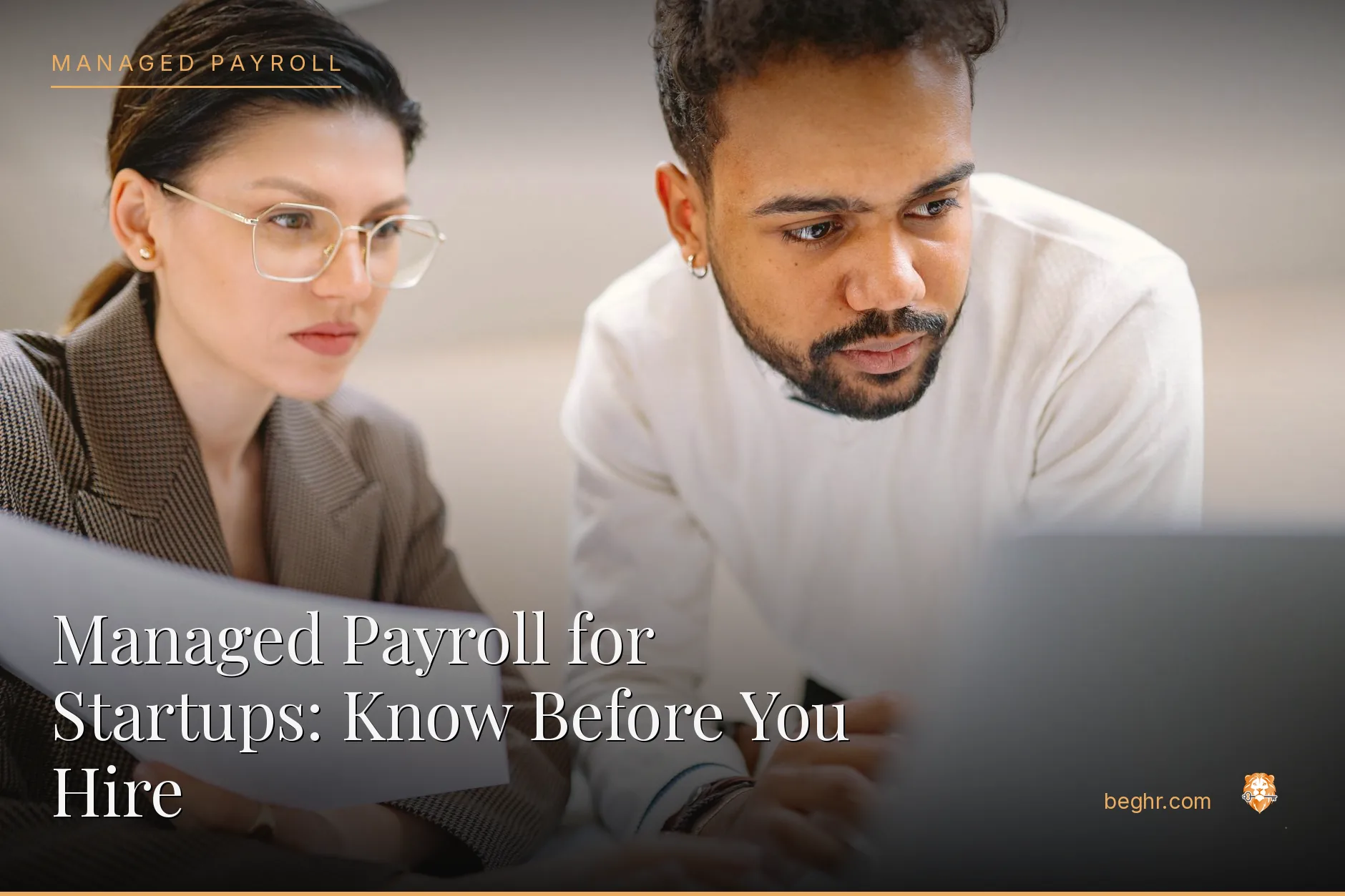 Business professionals reviewing payroll and HR documents in a bright modern office