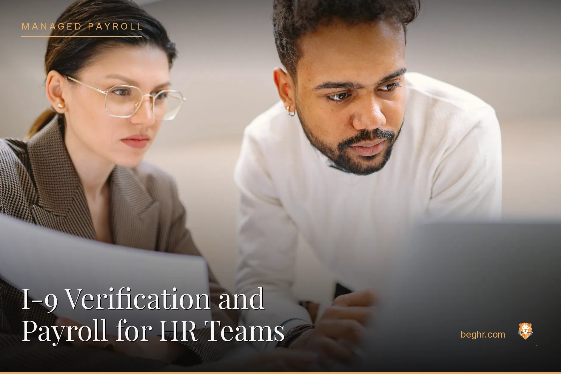 Business professionals reviewing payroll and HR documents in a bright modern office