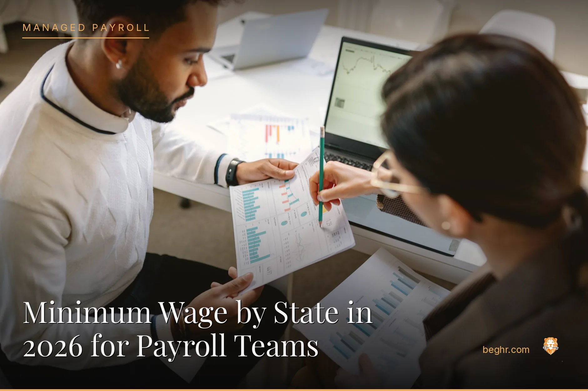 Business professionals reviewing payroll and HR documents in a bright modern office