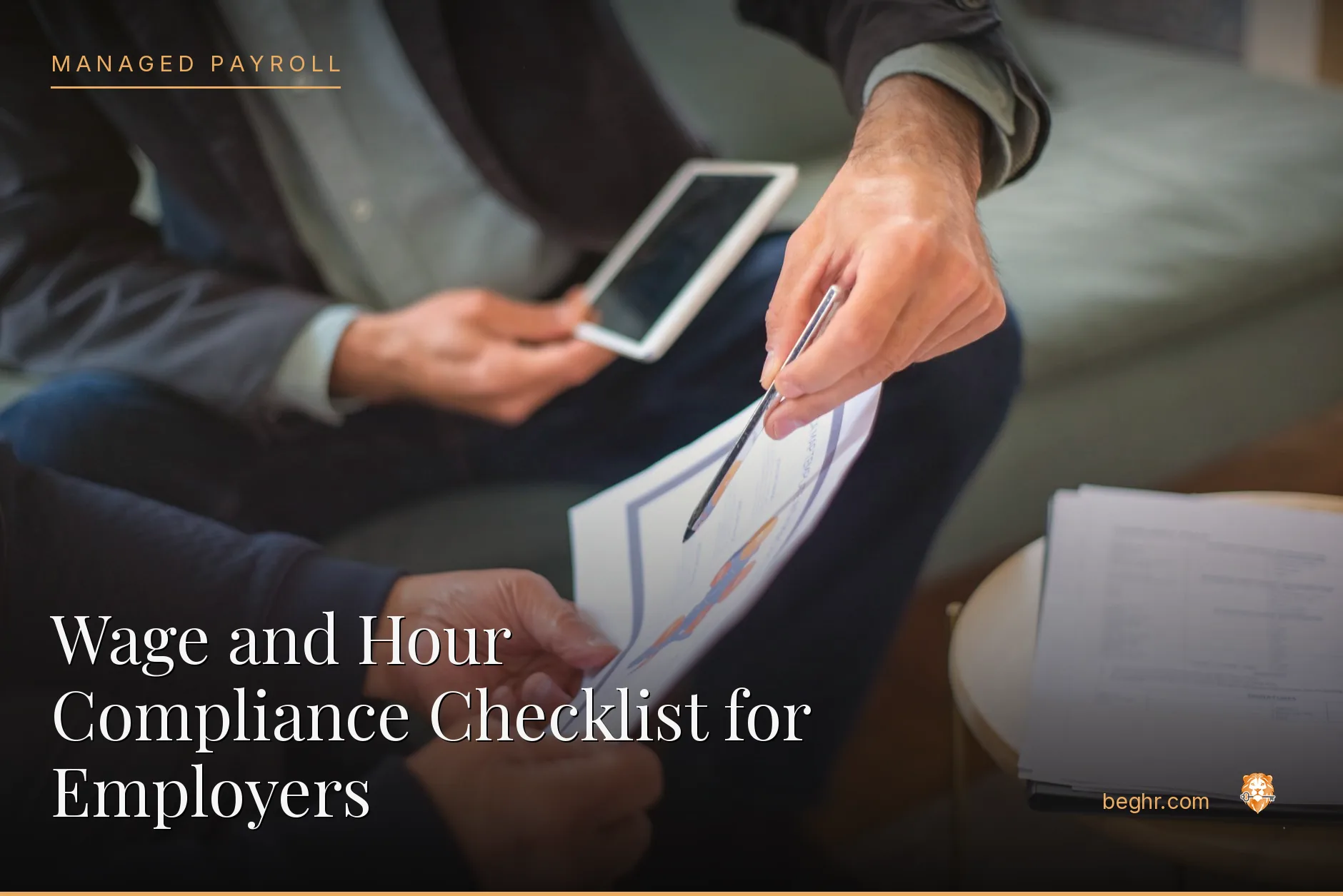 Business professionals reviewing payroll and HR documents in a bright modern office
