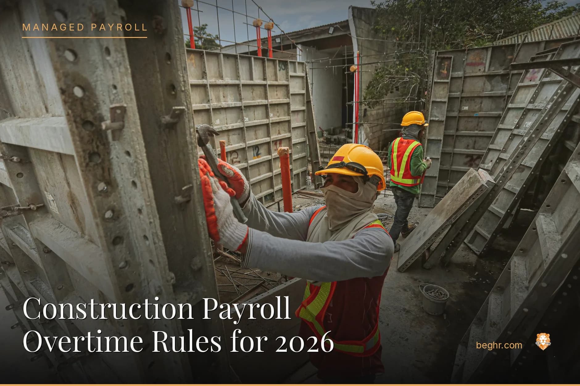 A real construction site, workers in hard hats and hi-vis vests reviewing plans