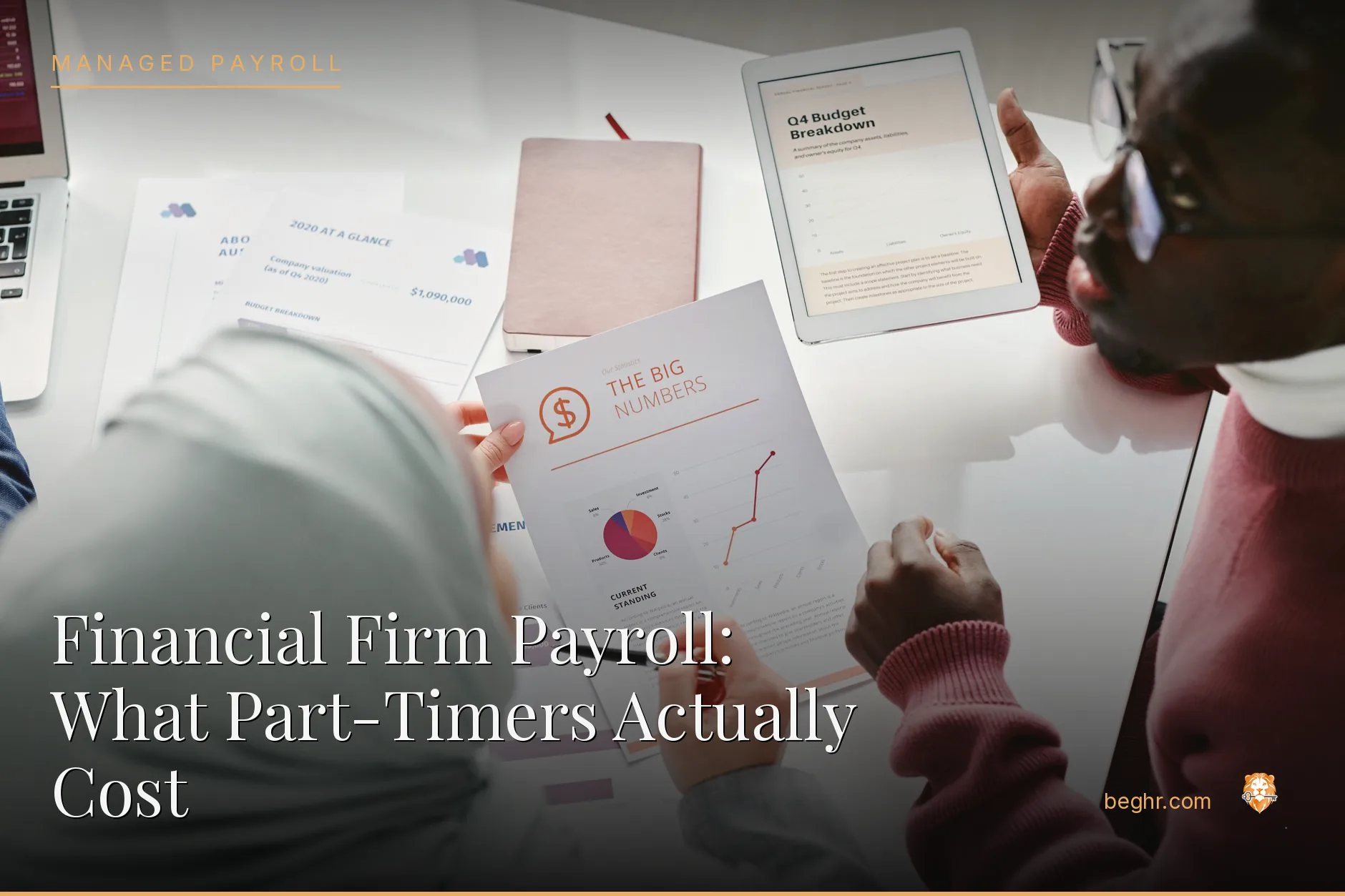 Business professionals reviewing payroll and HR documents in a bright modern office