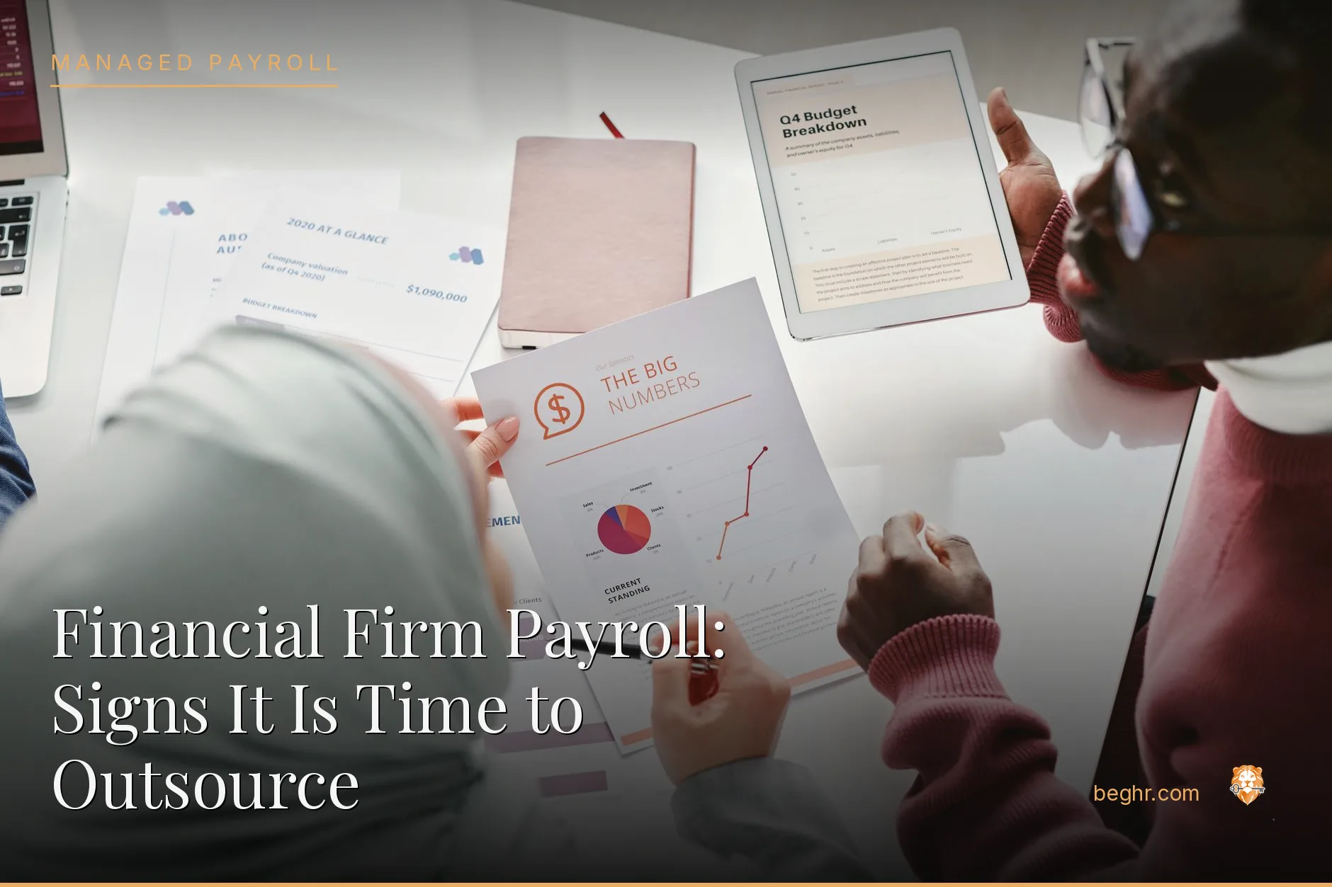 Business professionals reviewing payroll and HR documents in a bright modern office