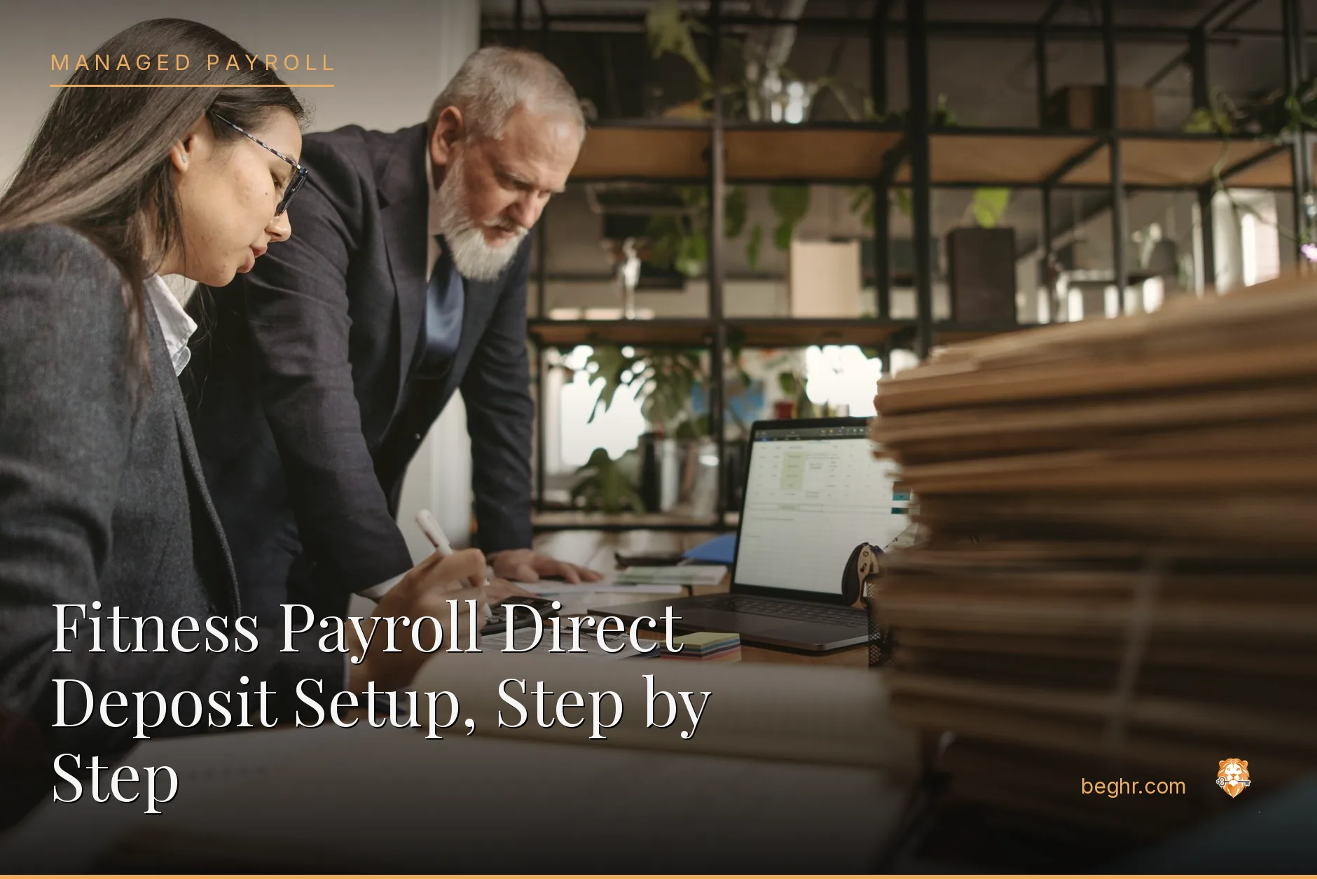 Business professionals reviewing payroll and HR documents in a bright modern office