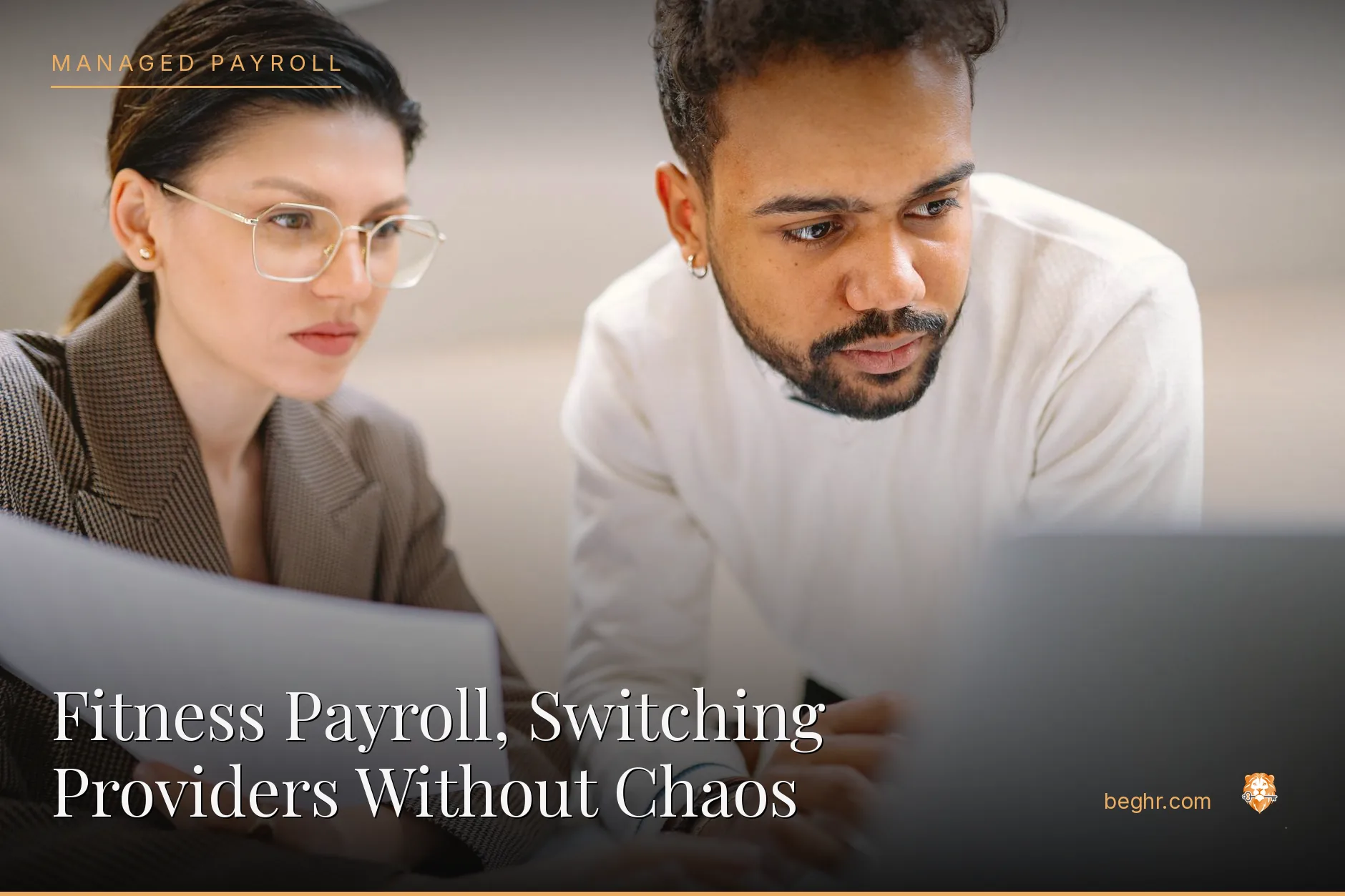 Business professionals reviewing payroll and HR documents in a bright modern office