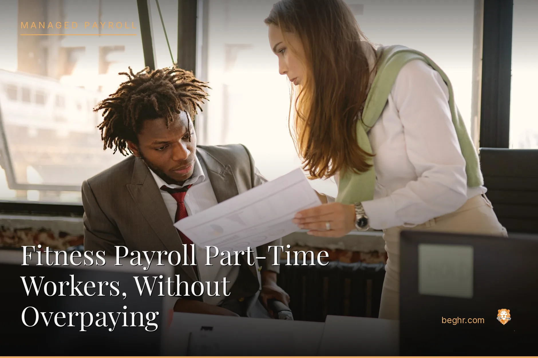 Business professionals reviewing payroll and HR documents in a bright modern office