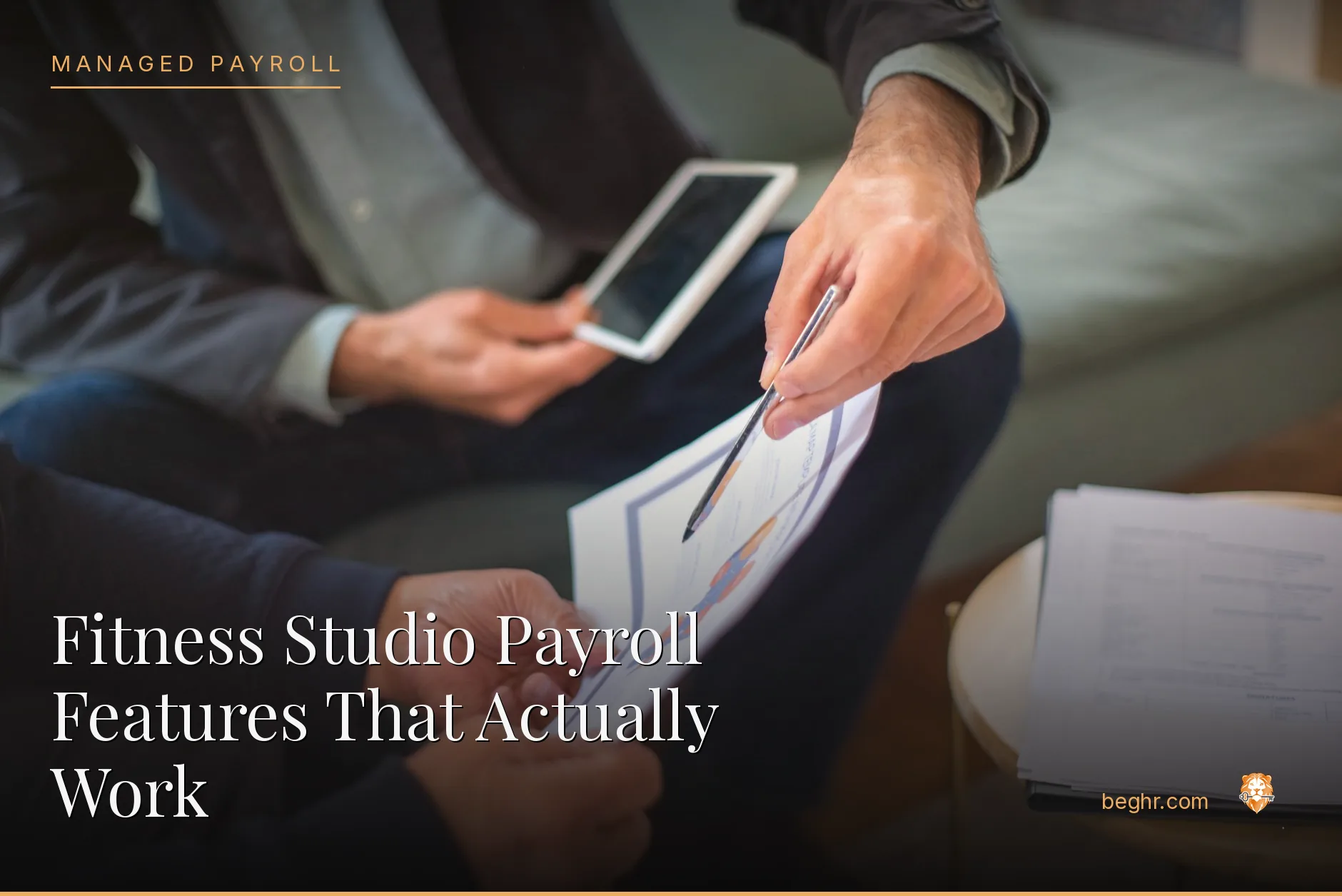 Business professionals reviewing payroll and HR documents in a bright modern office