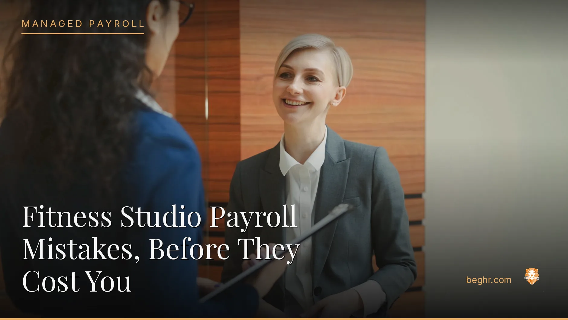 Business professionals reviewing payroll and HR documents in a bright modern office
