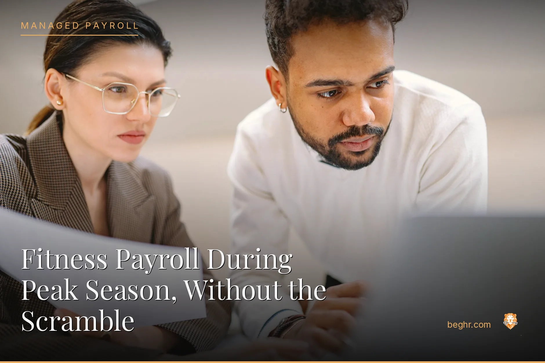 Business professionals reviewing payroll and HR documents in a bright modern office