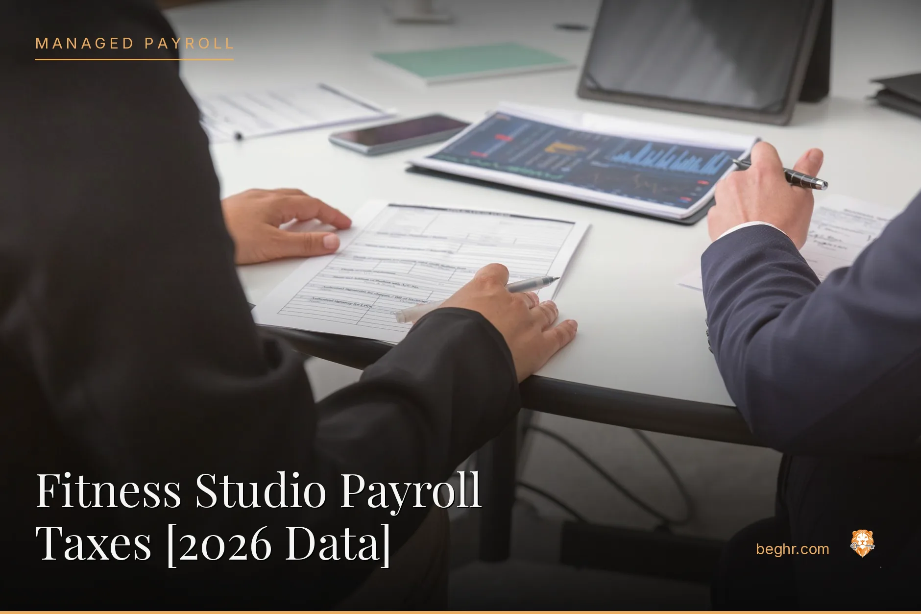 Business professionals reviewing payroll and HR documents in a bright modern office