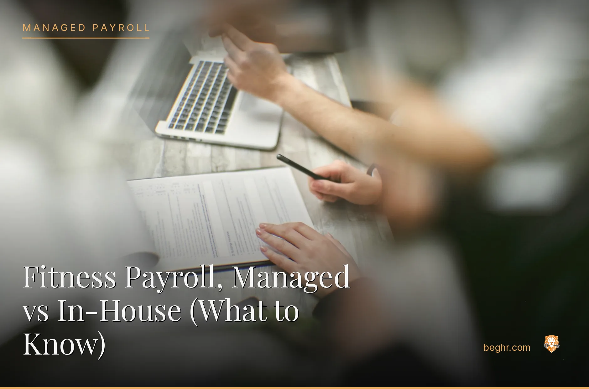 Business professionals reviewing payroll and HR documents in a bright modern office