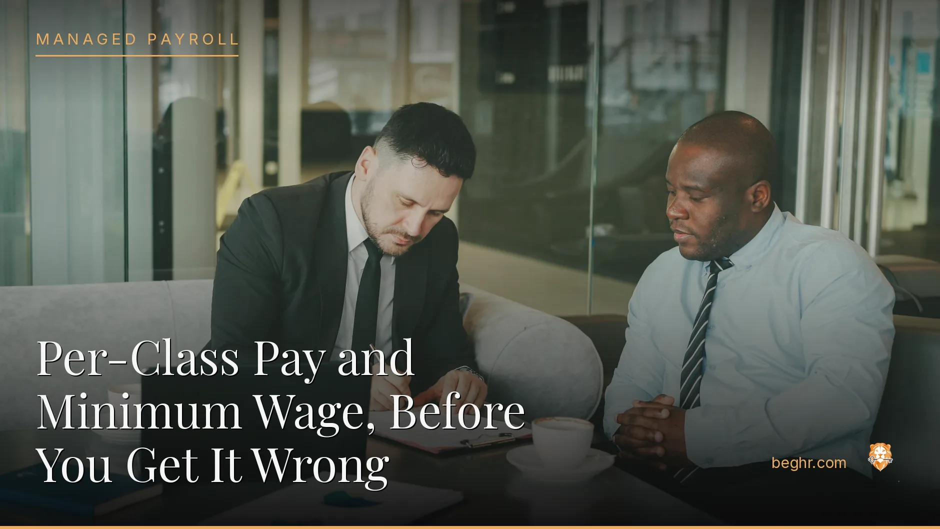 Business professionals reviewing payroll and HR documents in a bright modern office