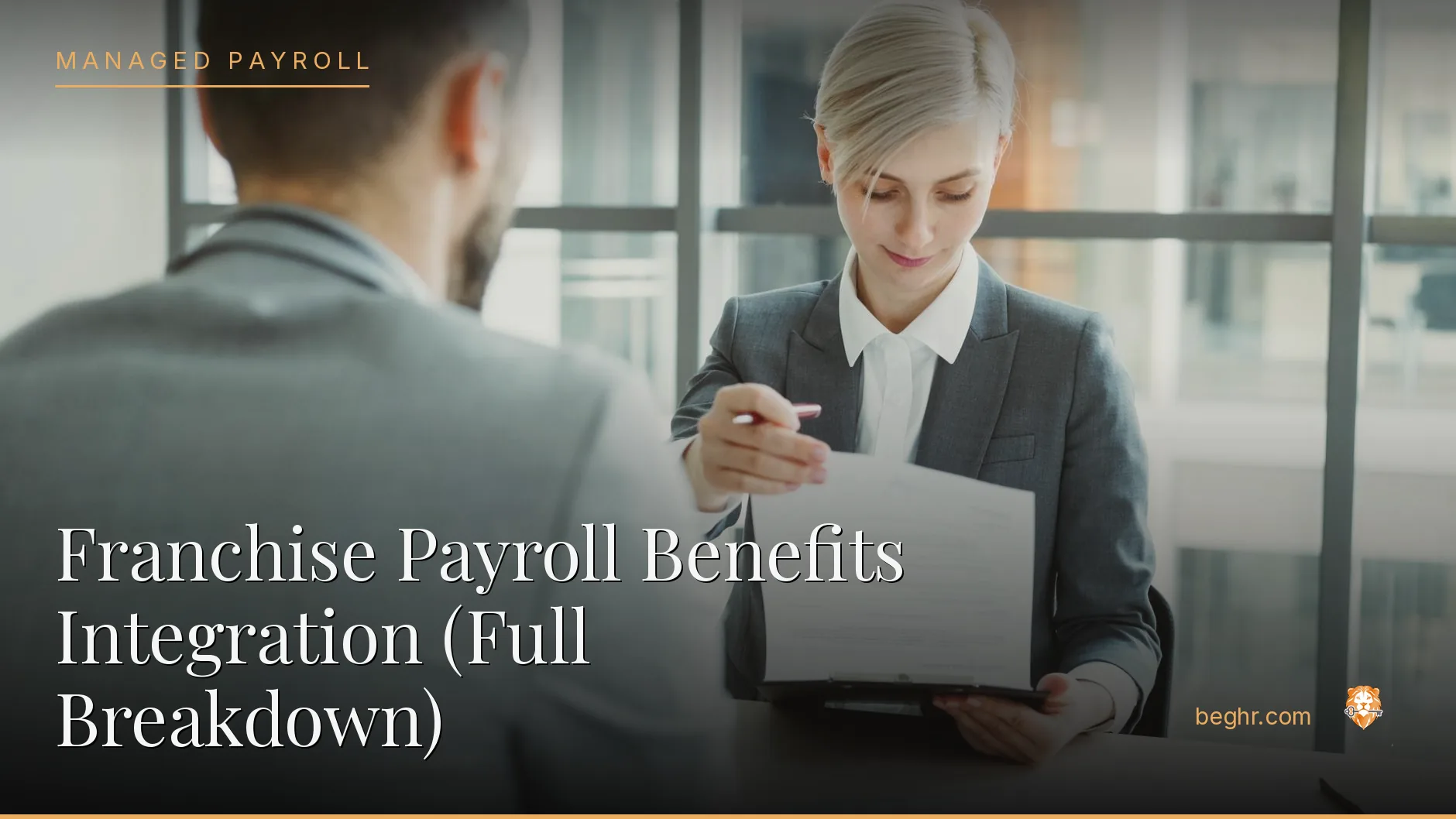 Business professionals reviewing payroll and HR documents in a bright modern office