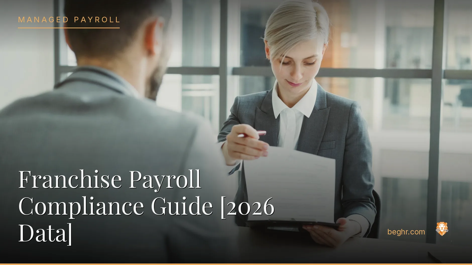 Business professionals reviewing payroll and HR documents in a bright modern office