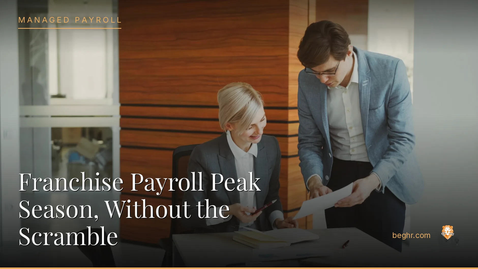 Business professionals reviewing payroll and HR documents in a bright modern office