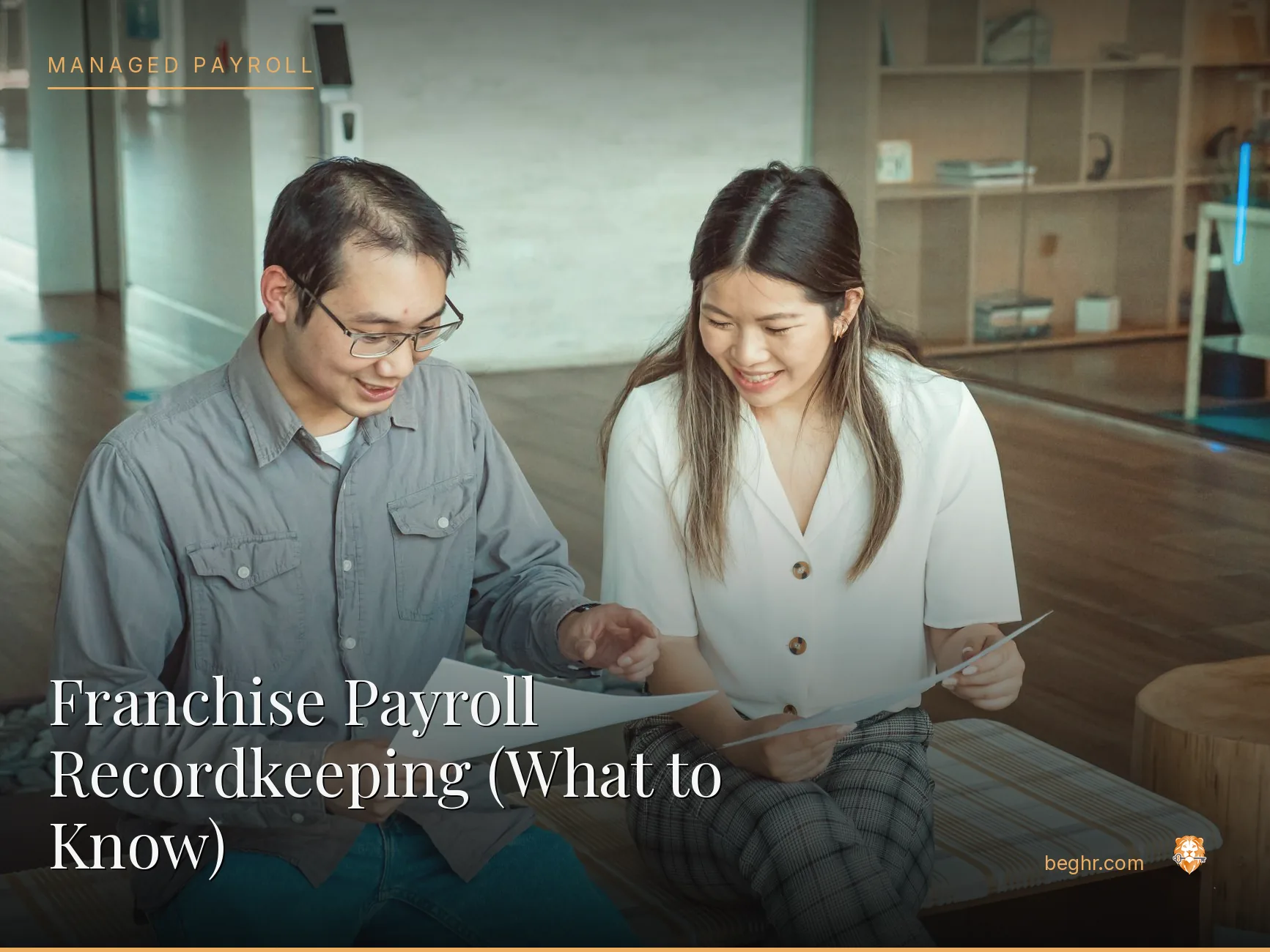 Business professionals reviewing payroll and HR documents in a bright modern office