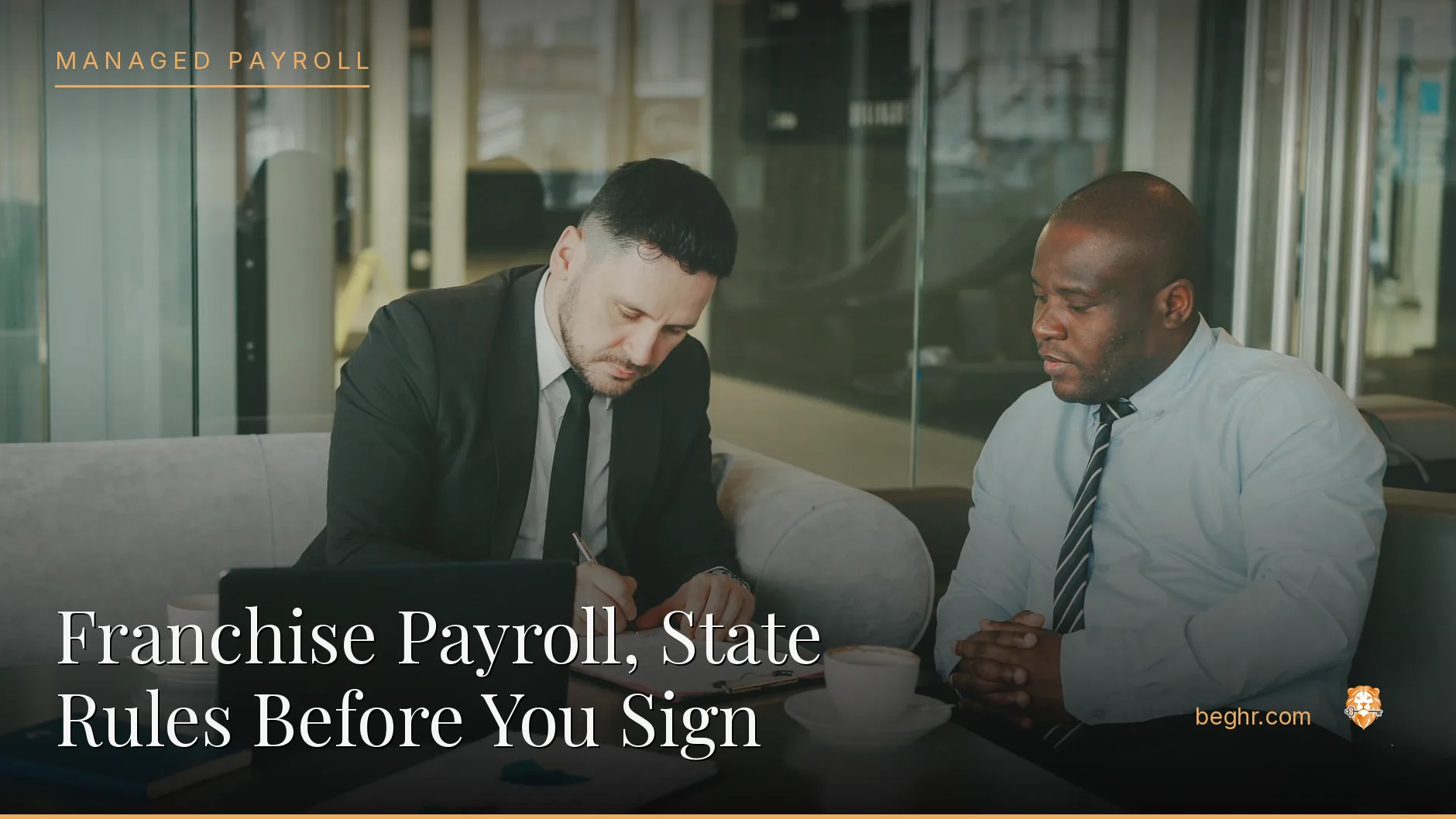 Business professionals reviewing payroll and HR documents in a bright modern office