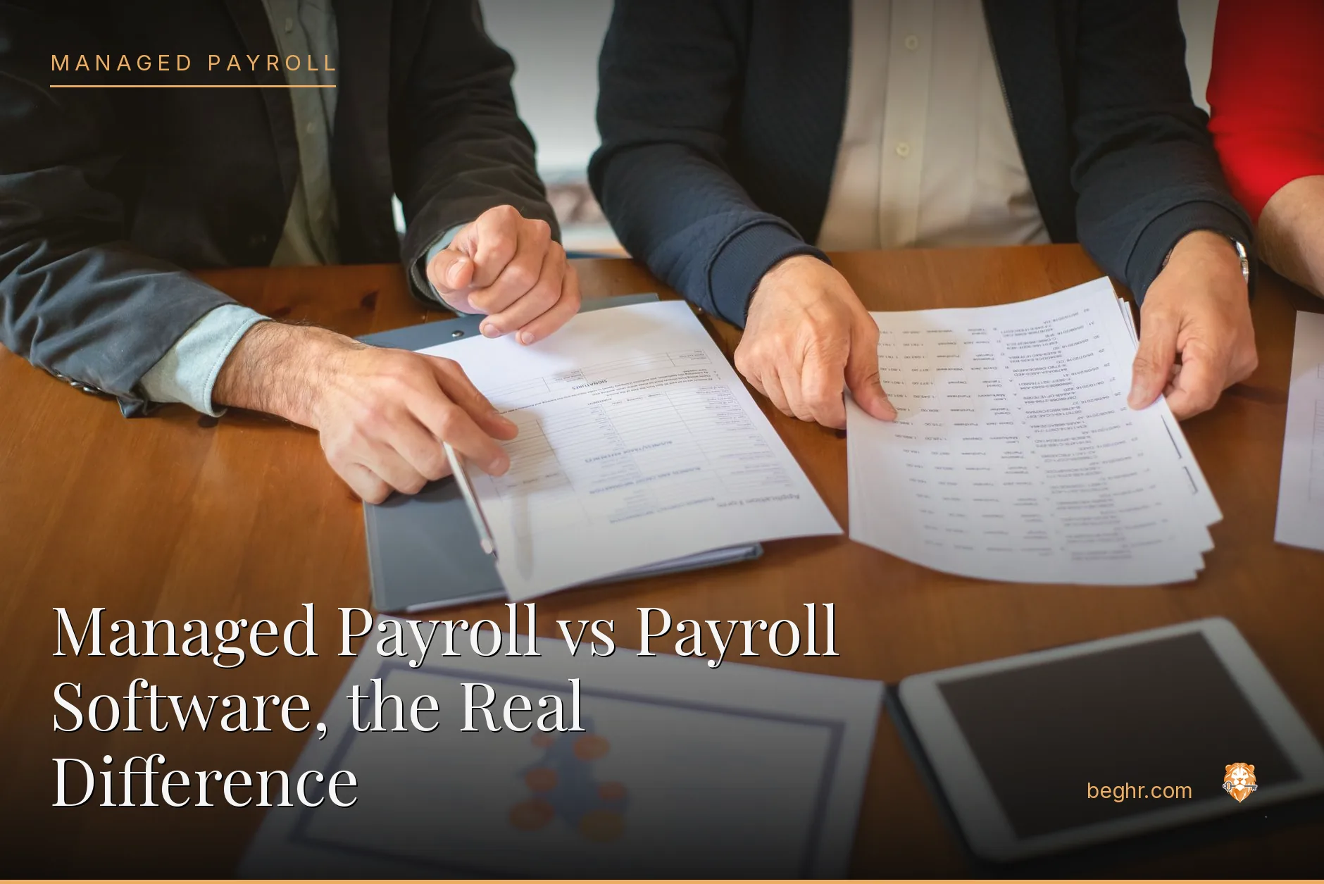 Business professionals reviewing payroll and HR documents in a bright modern office