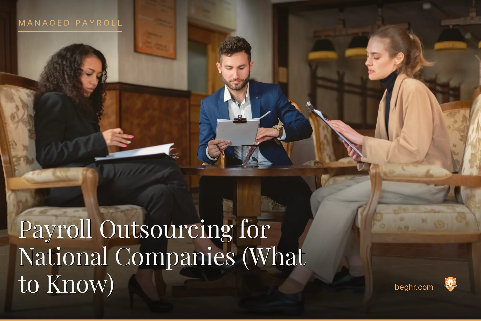 Business professionals reviewing payroll and HR documents in a bright modern office