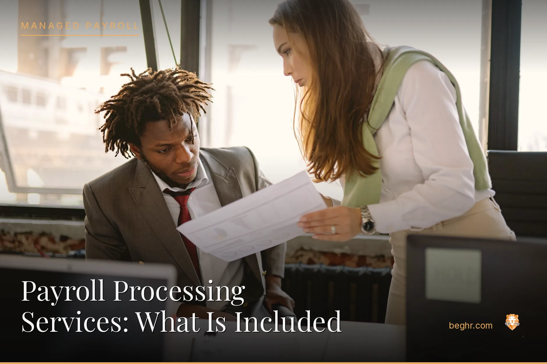 Business professionals reviewing payroll and HR documents in a bright modern office