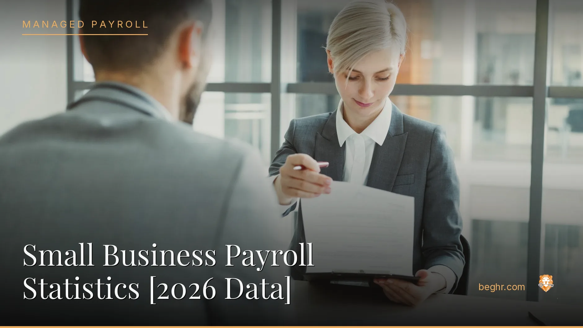 Business professionals reviewing payroll and HR documents in a bright modern office