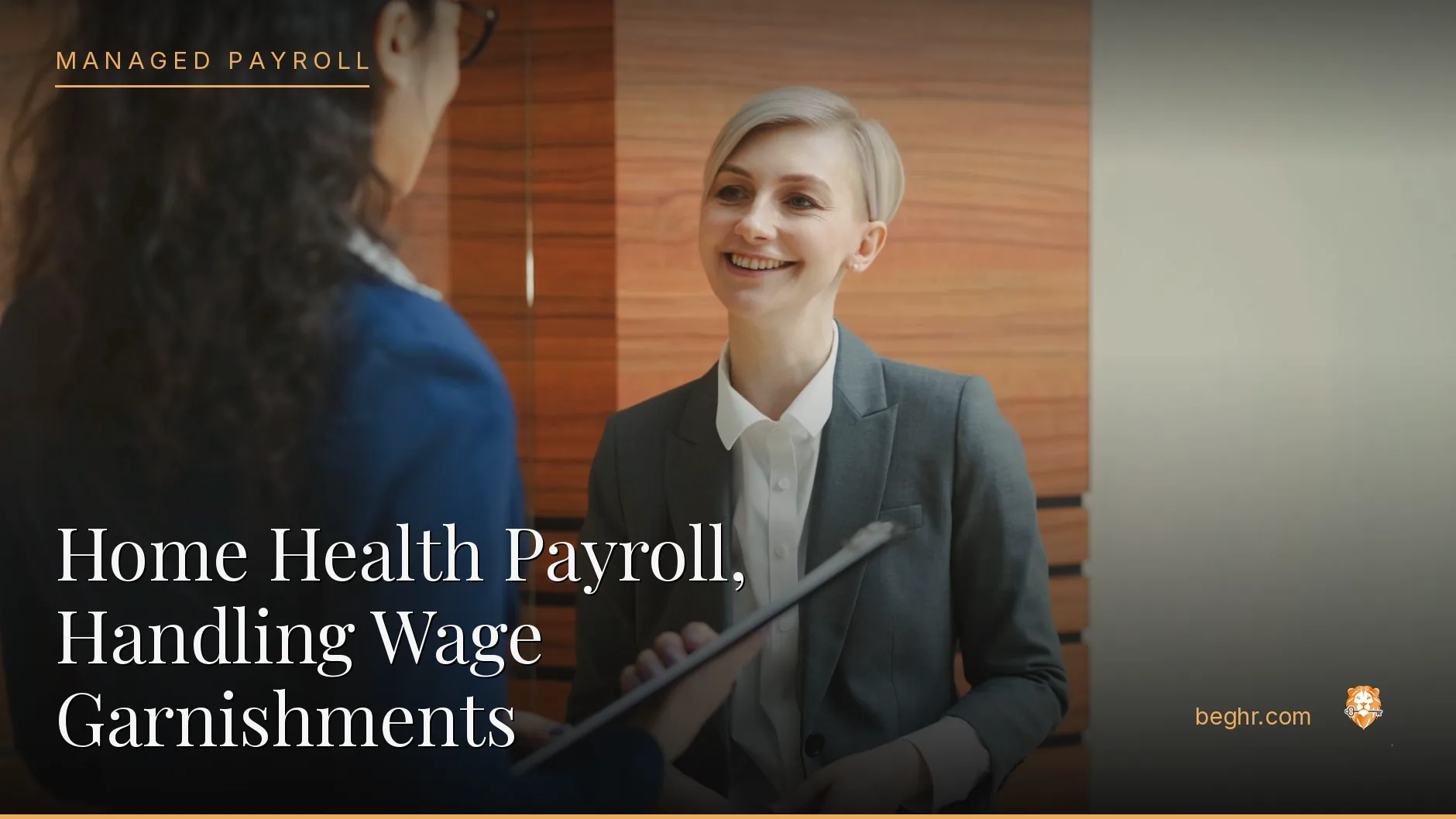 Business professionals reviewing payroll and HR documents in a bright modern office