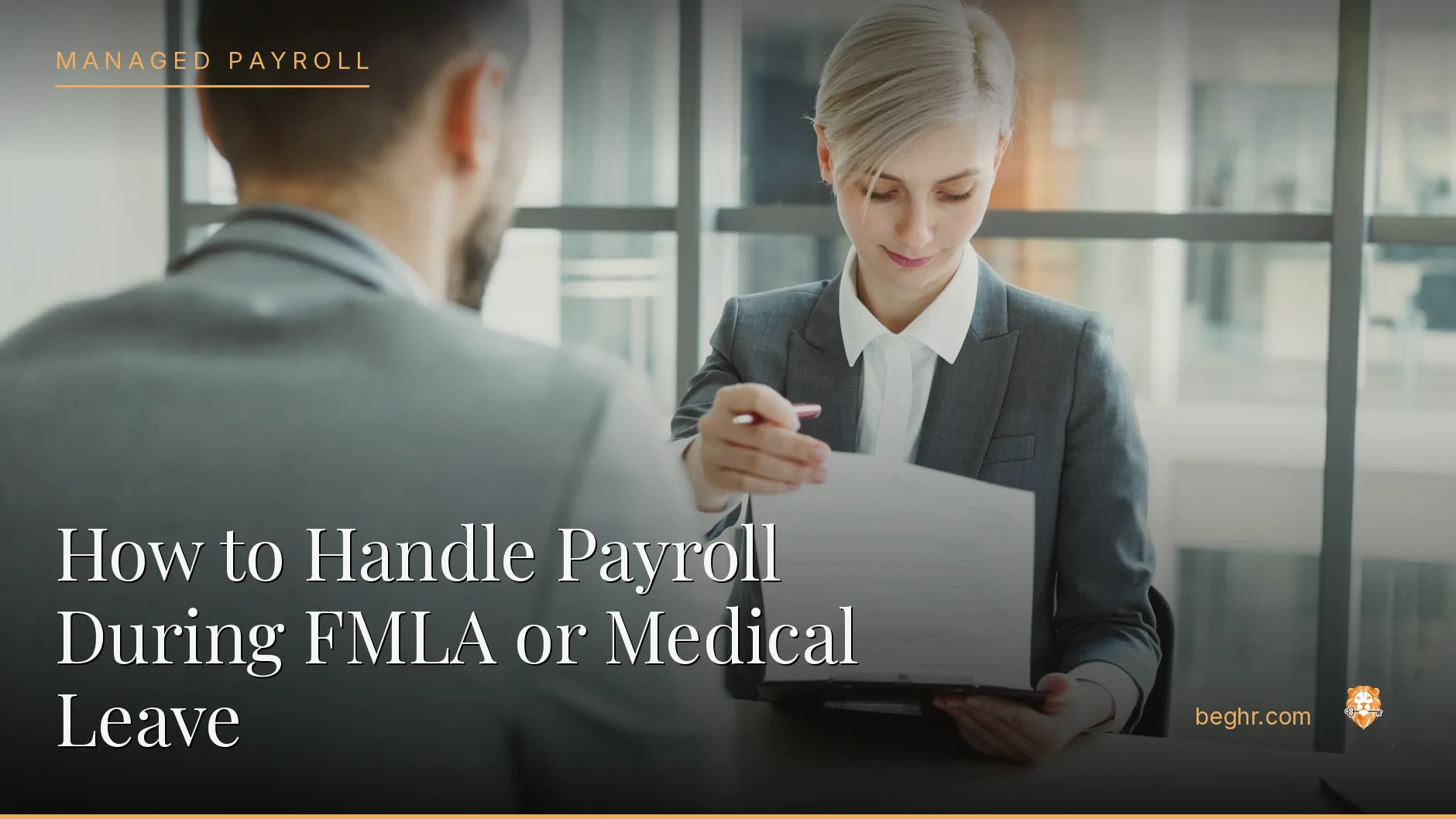 Business professionals reviewing payroll and HR documents in a bright modern office