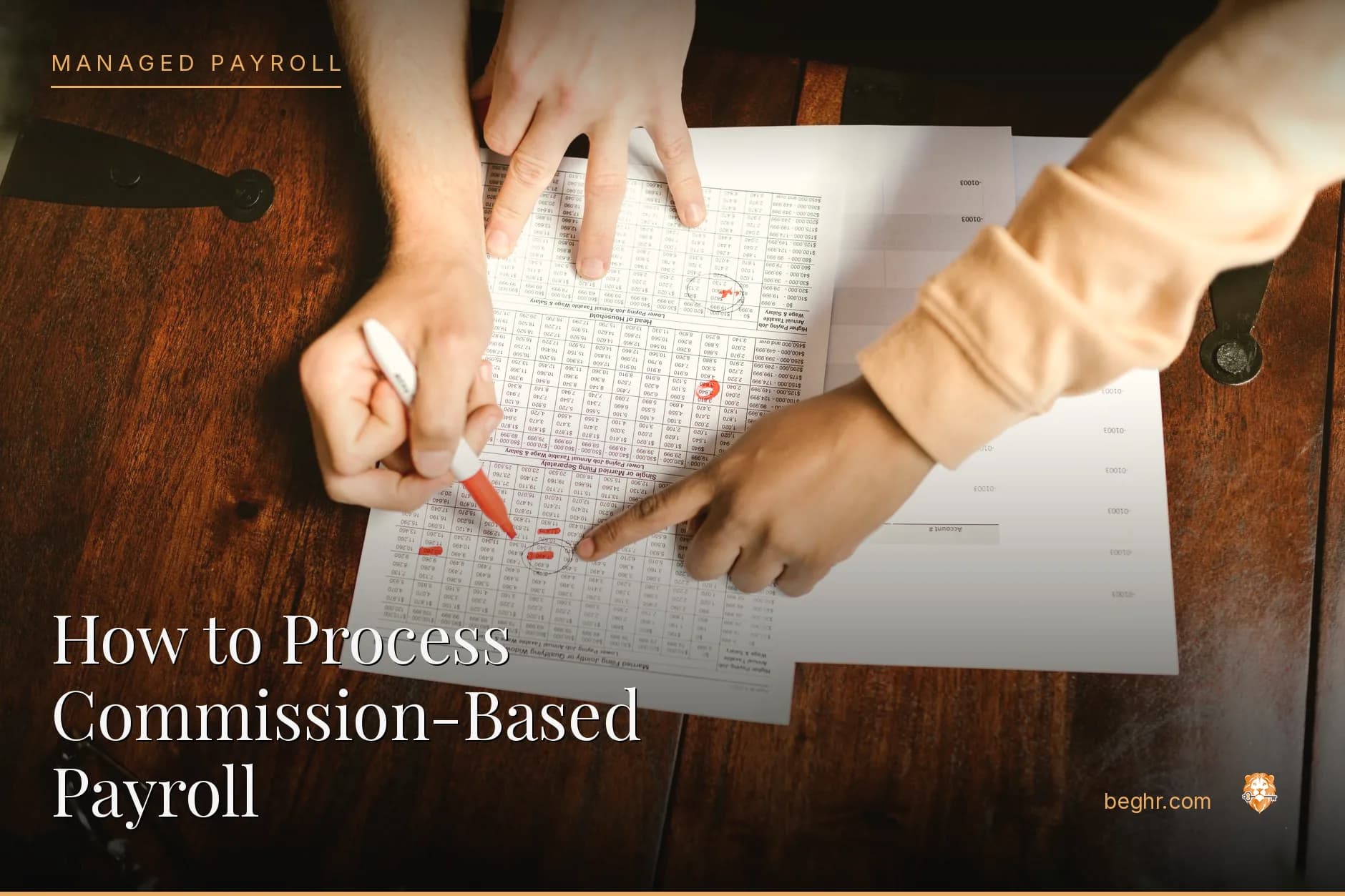 Business professionals reviewing payroll and HR documents in a bright modern office