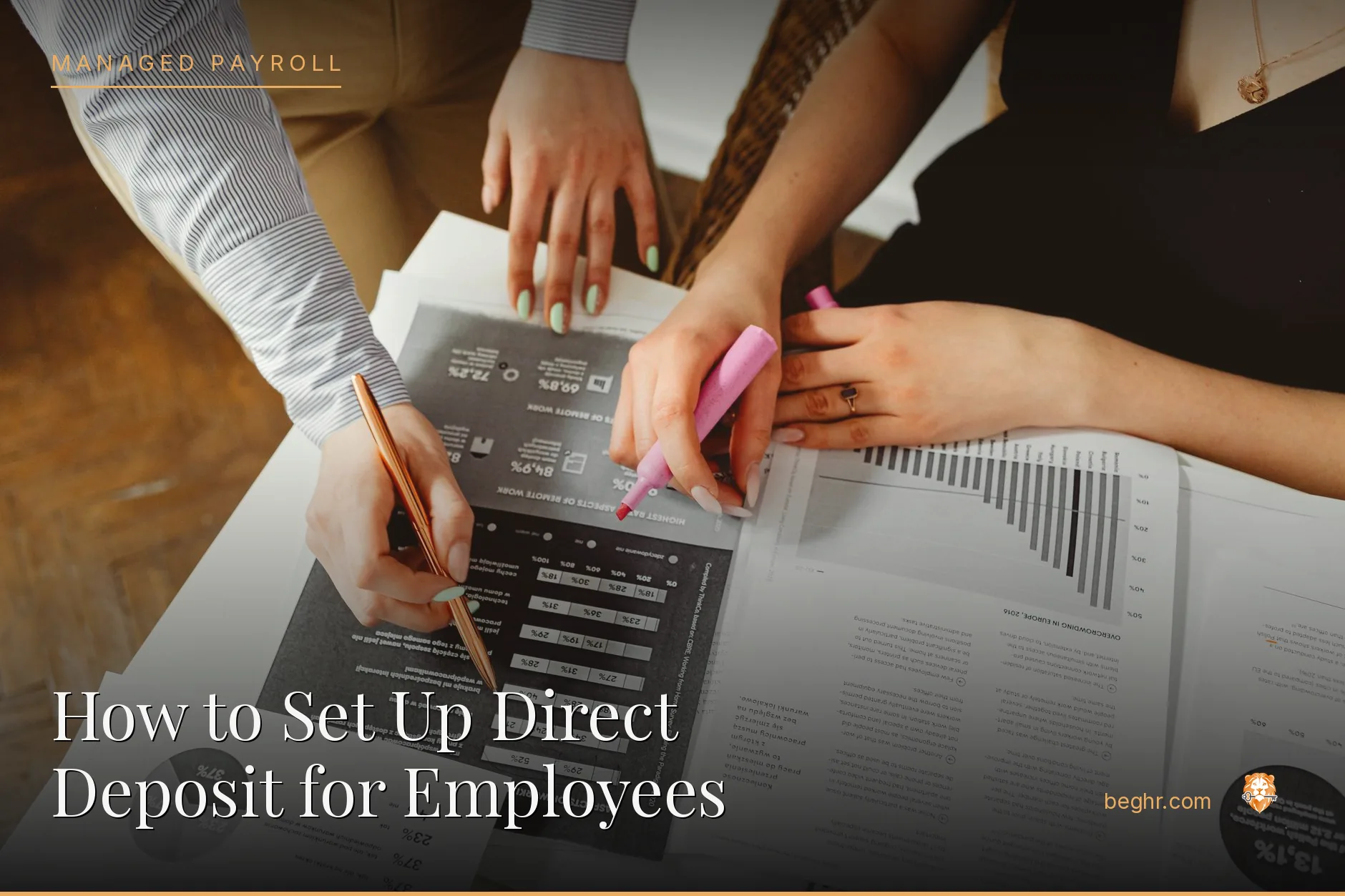 Business professionals reviewing payroll and HR documents in a bright modern office