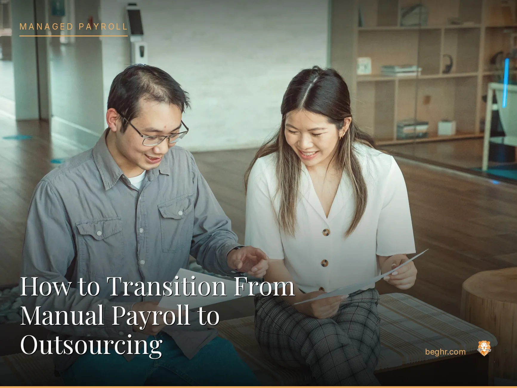 Business professionals reviewing payroll and HR documents in a bright modern office