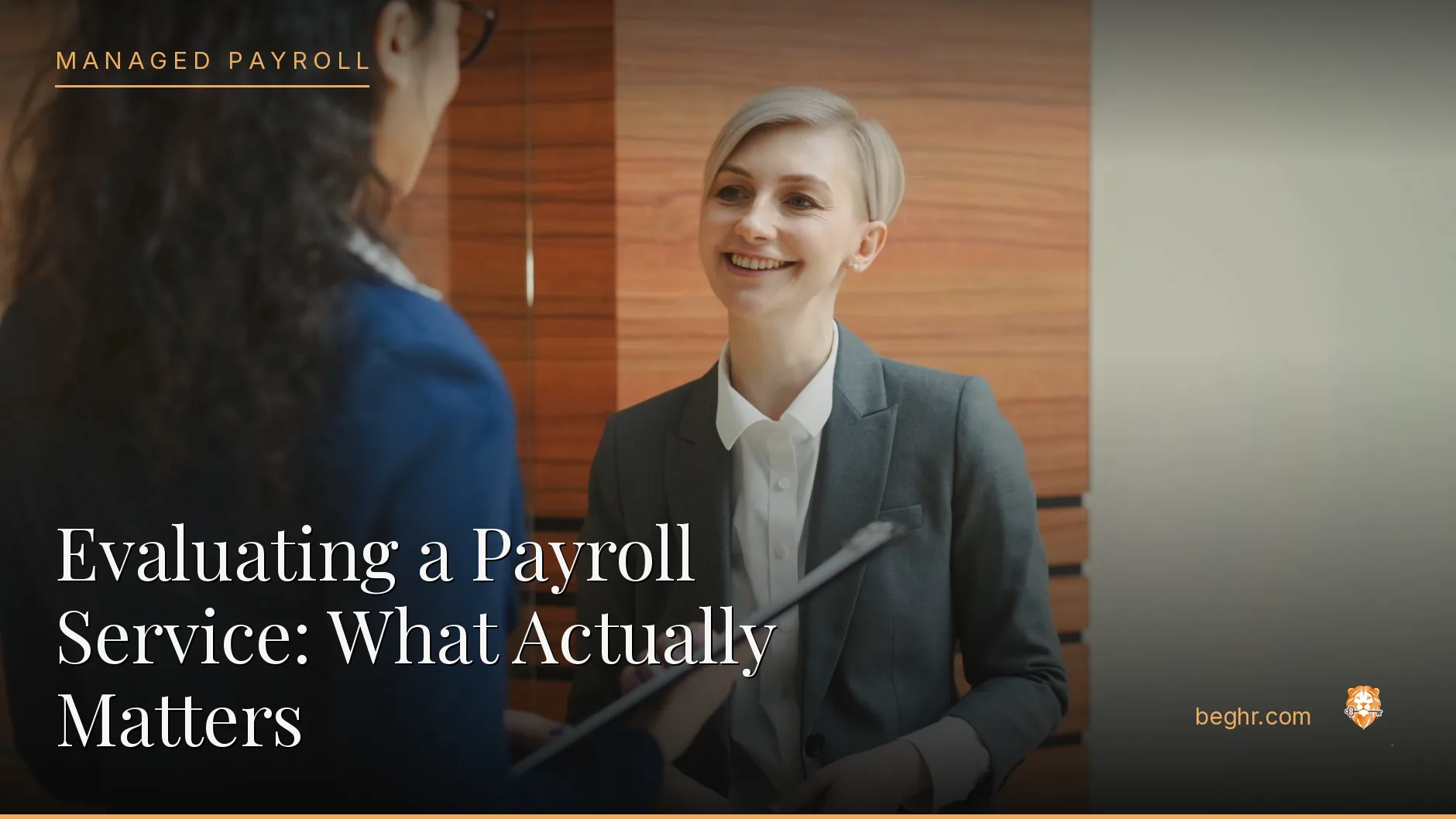 Business professionals reviewing payroll and HR documents in a bright modern office