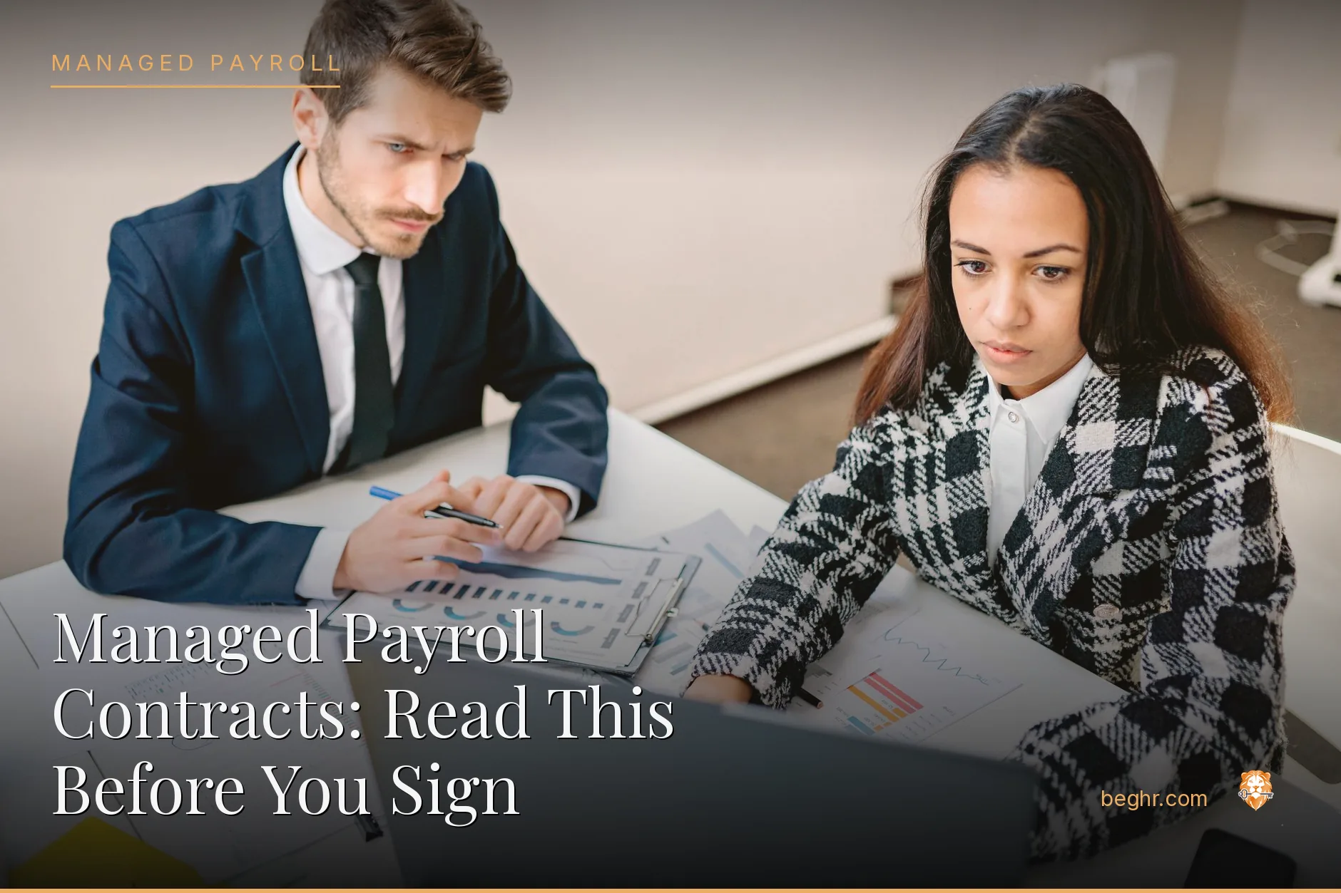 Business professionals reviewing payroll and HR documents in a bright modern office