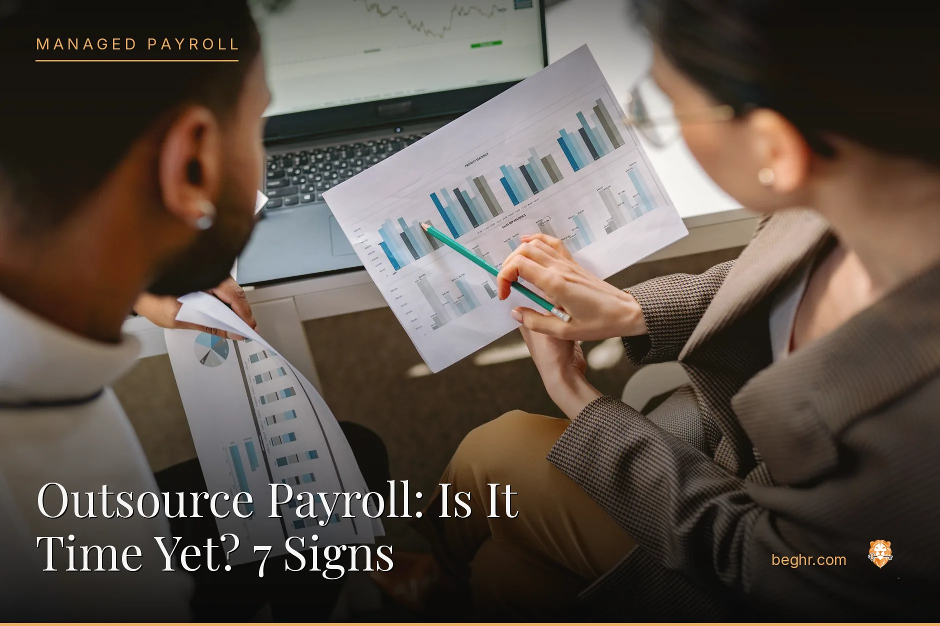 Business professionals reviewing payroll and HR documents in a bright modern office