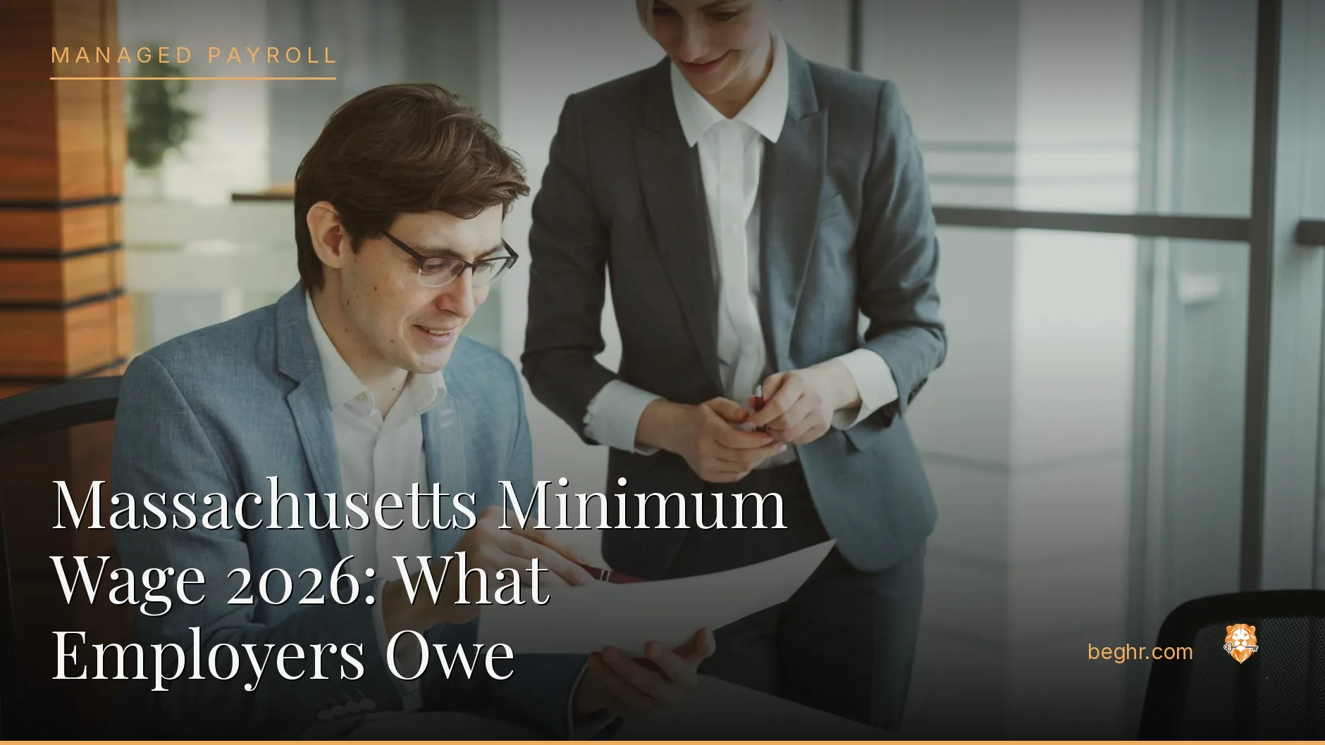 Business professionals reviewing payroll and HR documents in a bright modern office