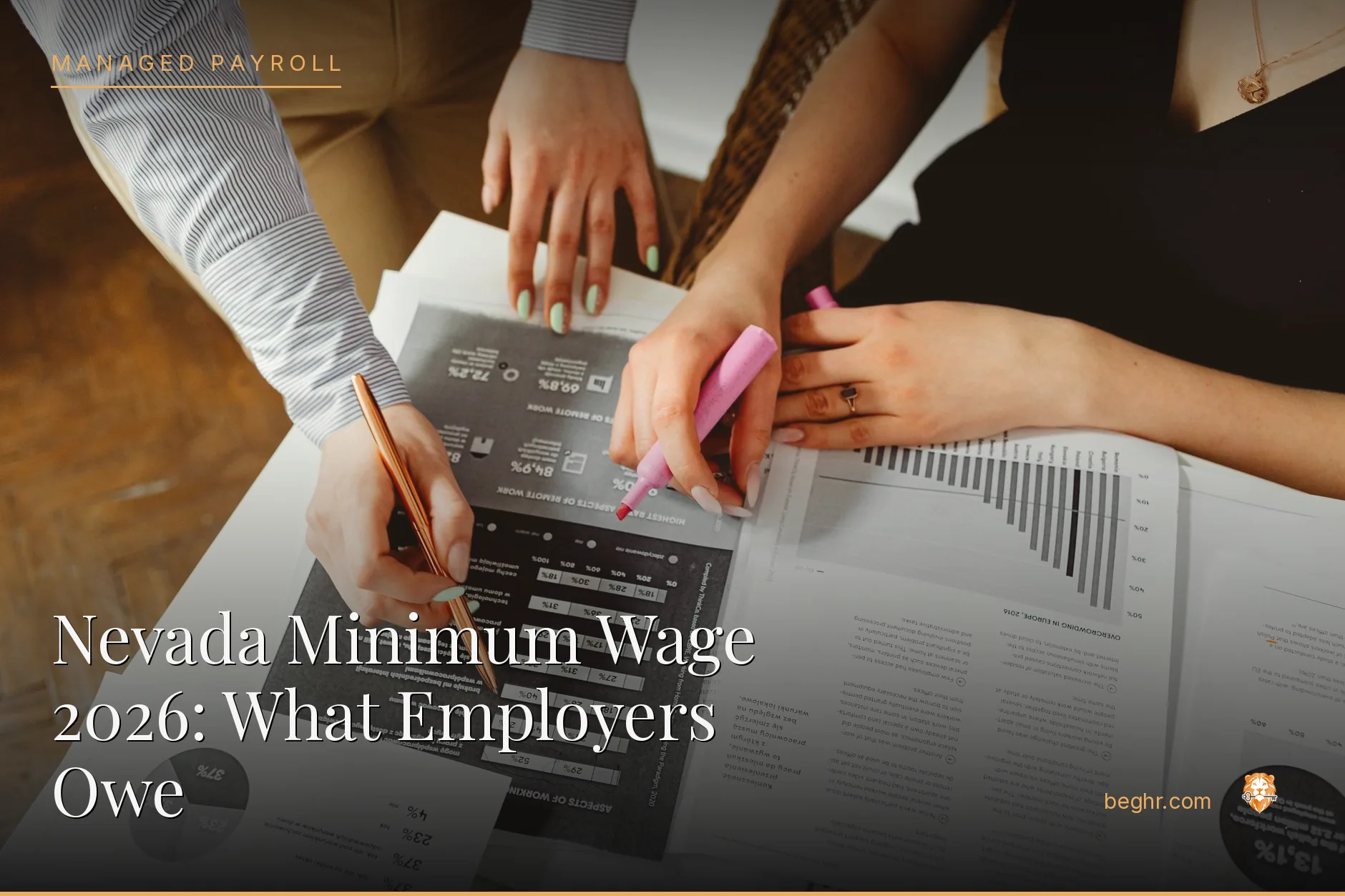Business professionals reviewing payroll and HR documents in a bright modern office