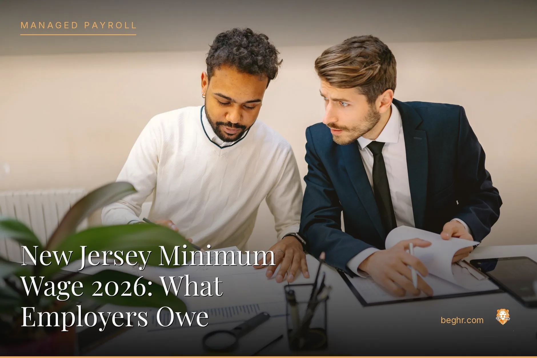 Business professionals reviewing payroll and HR documents in a bright modern office