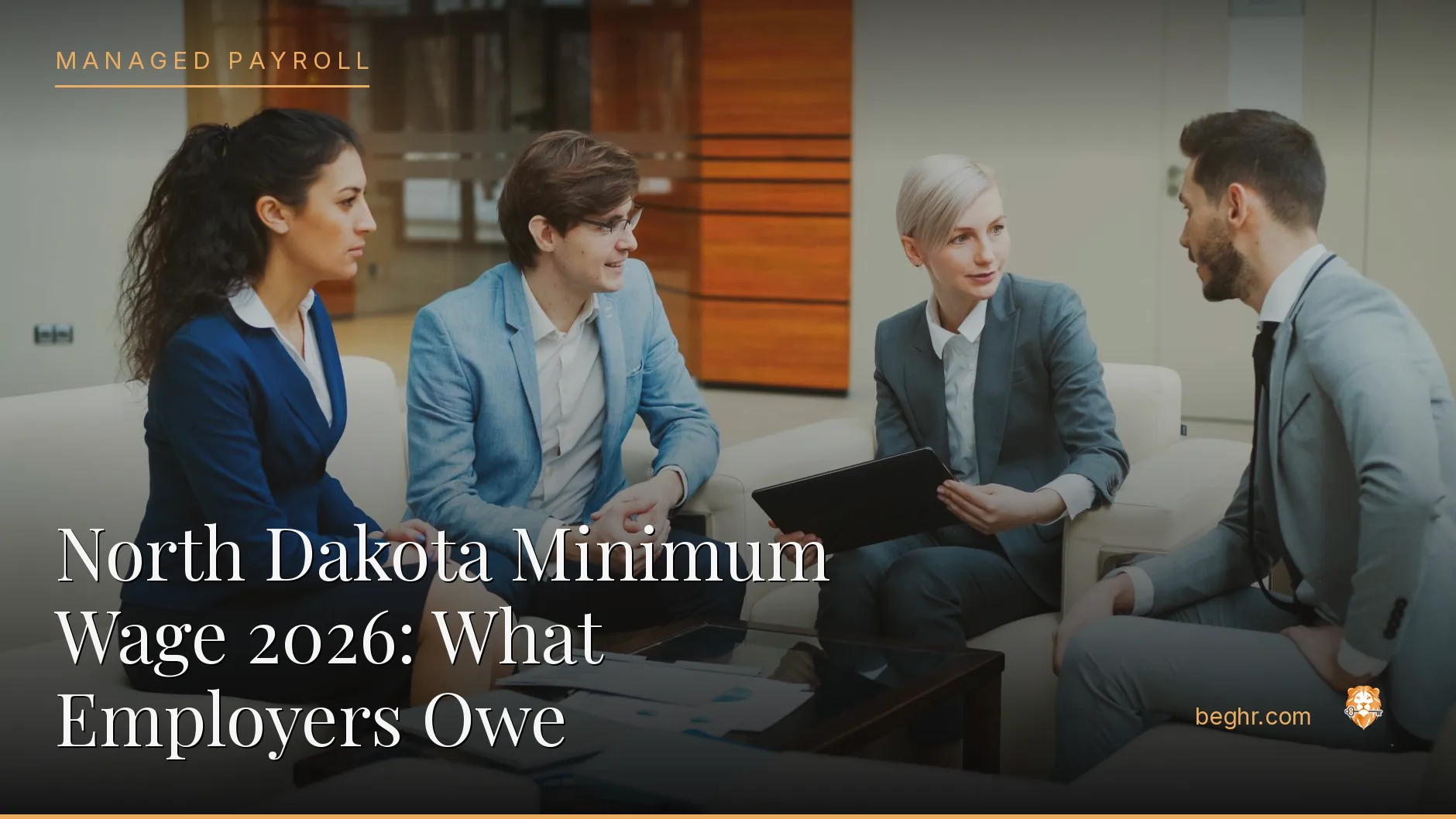 Business professionals reviewing payroll and HR documents in a bright modern office