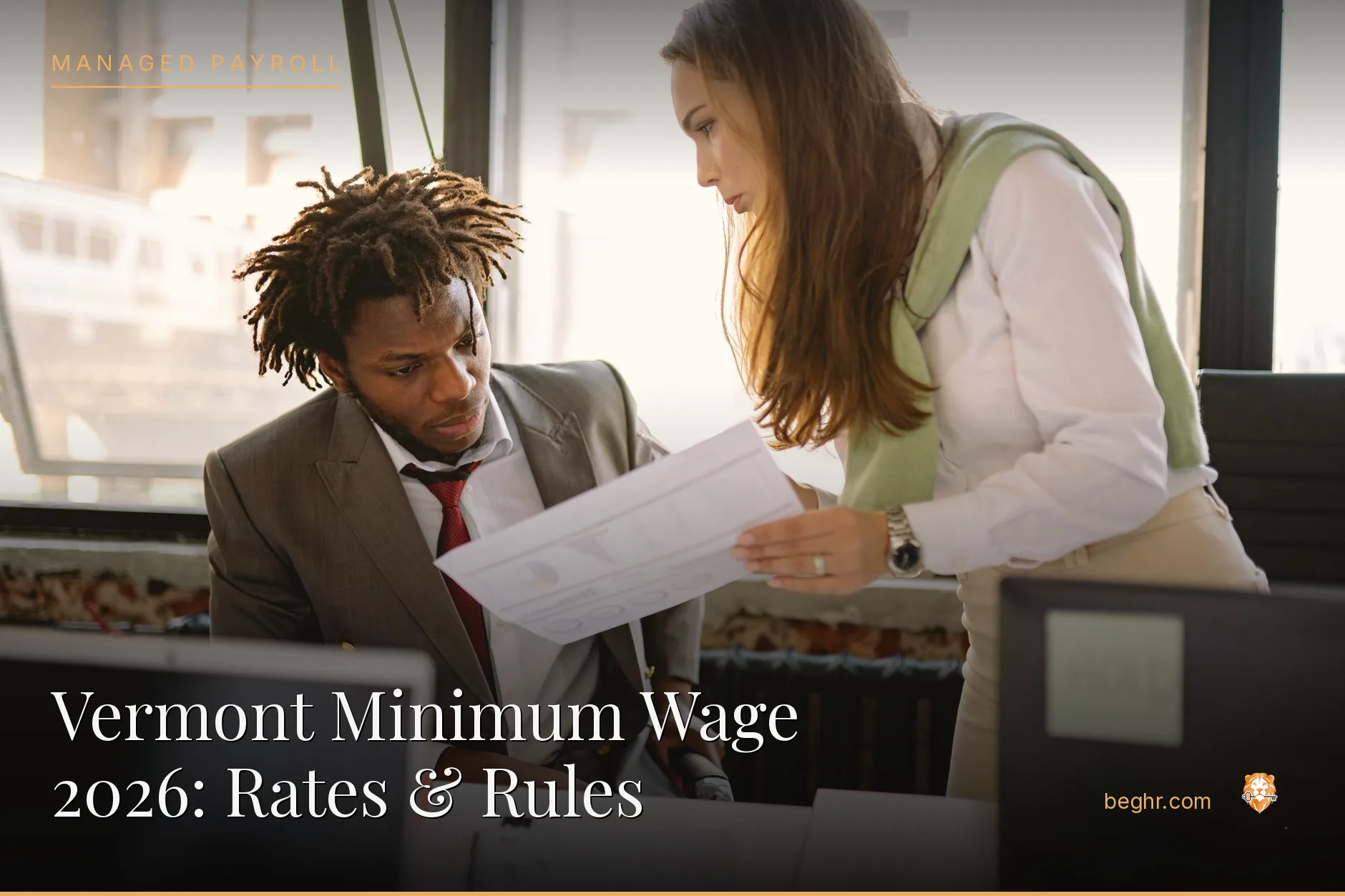 Business professionals reviewing payroll and HR documents in a bright modern office