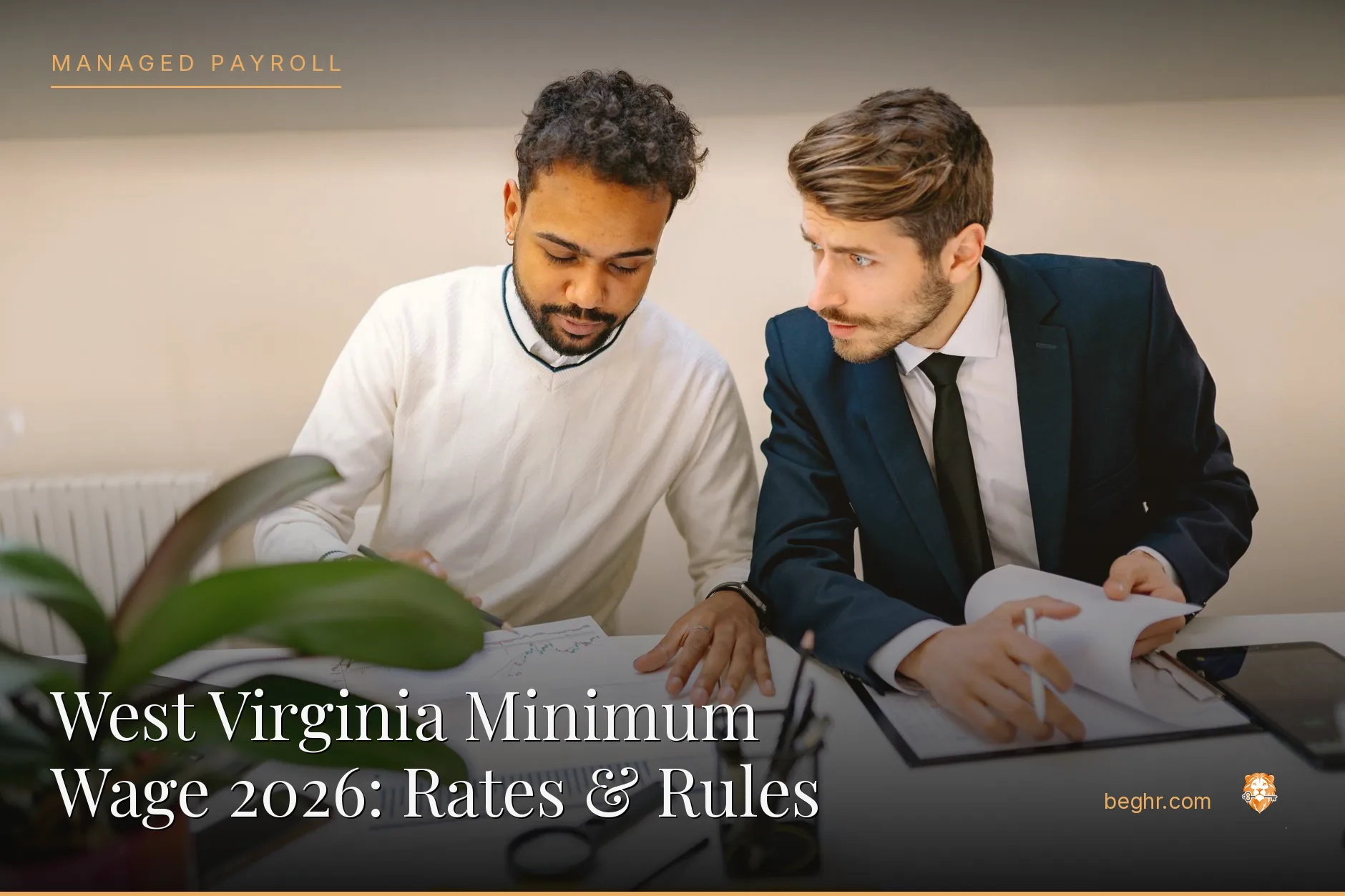 Business professionals reviewing payroll and HR documents in a bright modern office