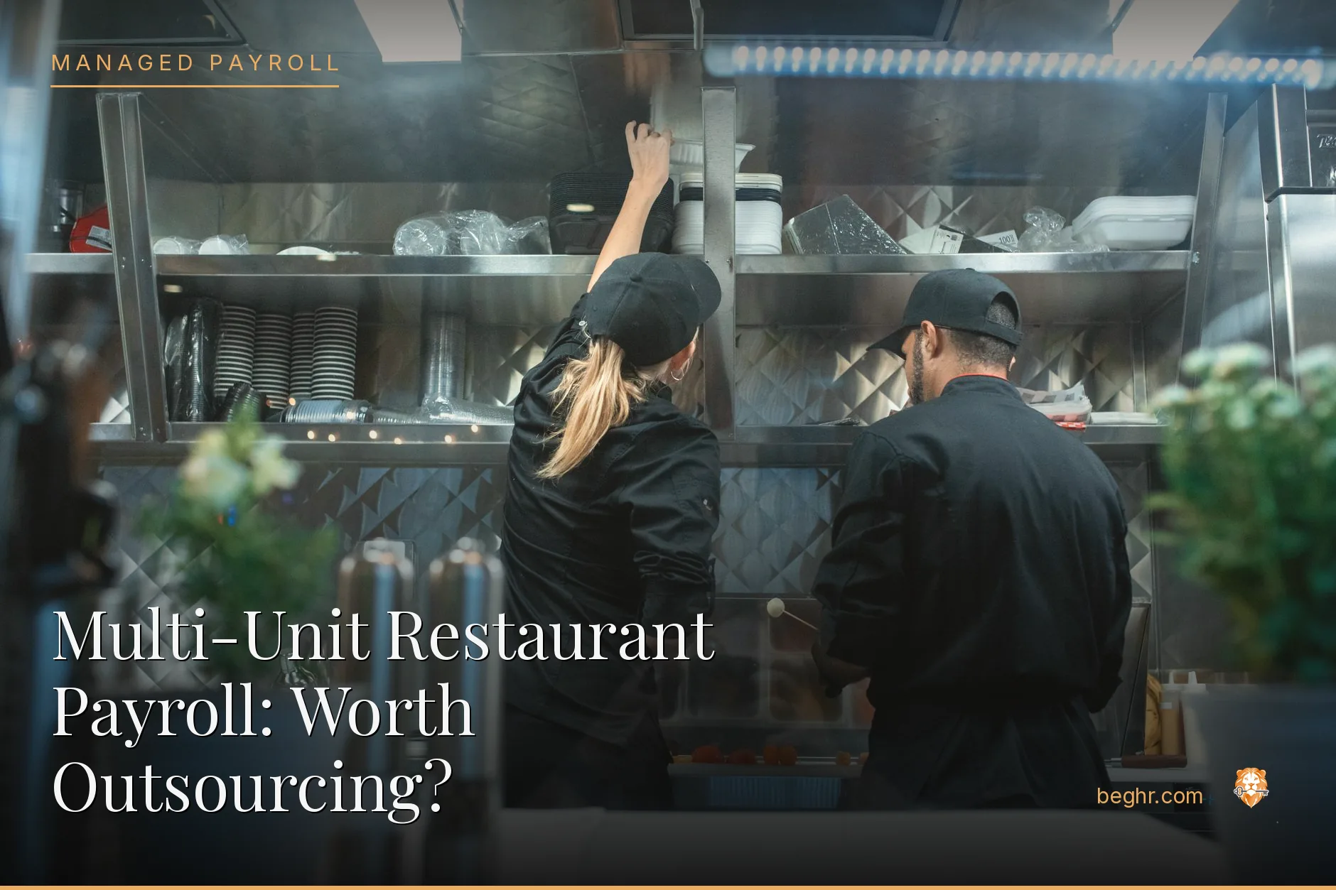 A busy modern restaurant kitchen with chefs and staff working the line
